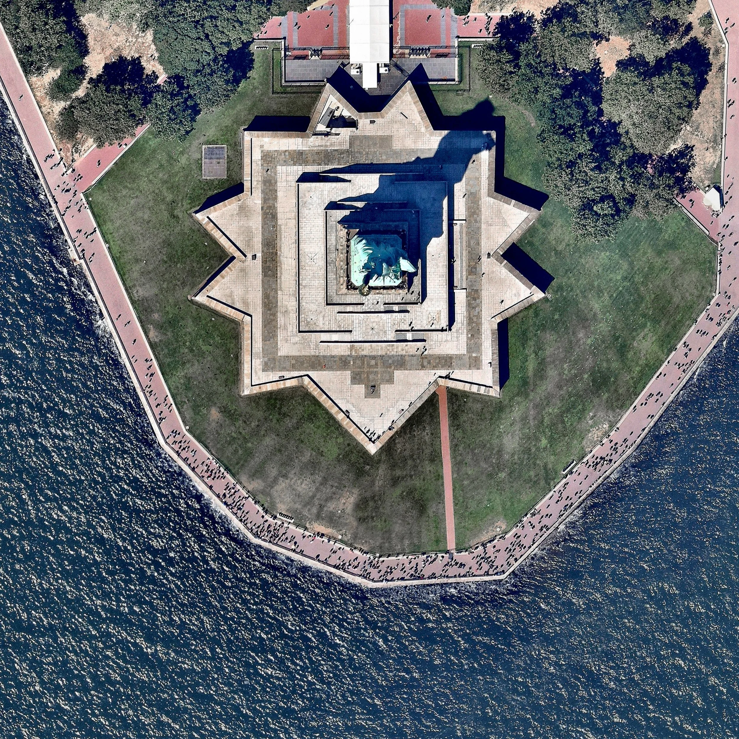 Happy Fourth of July! The incredible shot shows the Statue of Liberty in New York City. The colossal copper structure depicts a robed female figure — Libertas, the Roman goddess of liberty — who bears a torch and a tablet upon which is inscribed the date of the American Declaration of Independence — July 4, 1776. The statue is an American icon of freedom and a welcoming sight to immigrants arriving from abroad. 40°41′21″N, 74°2′40″W Source imagery: Nearmap