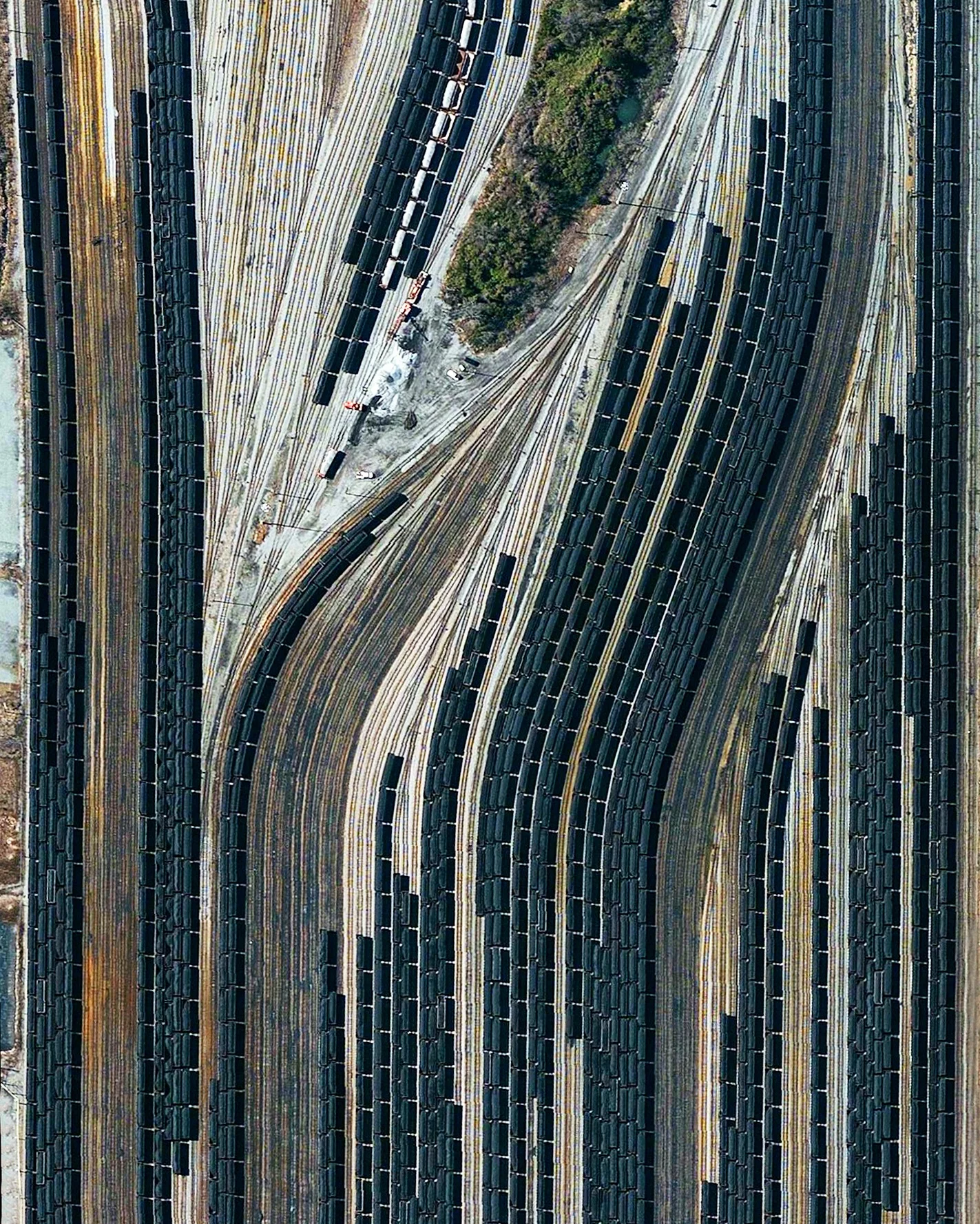 Train cars filled with coal are stationed in Norfolk, Virginia. Operated by the Norfolk Southern corporation, Lamberts Point Pier 6 is the largest coal-loading station in the Northern Hemisphere and serves at the temporary depot for the company’s fleet of 23,000 coal cars. 36°52'30.9"N, 76°19'12.9"W Source imagery: Nearmap
