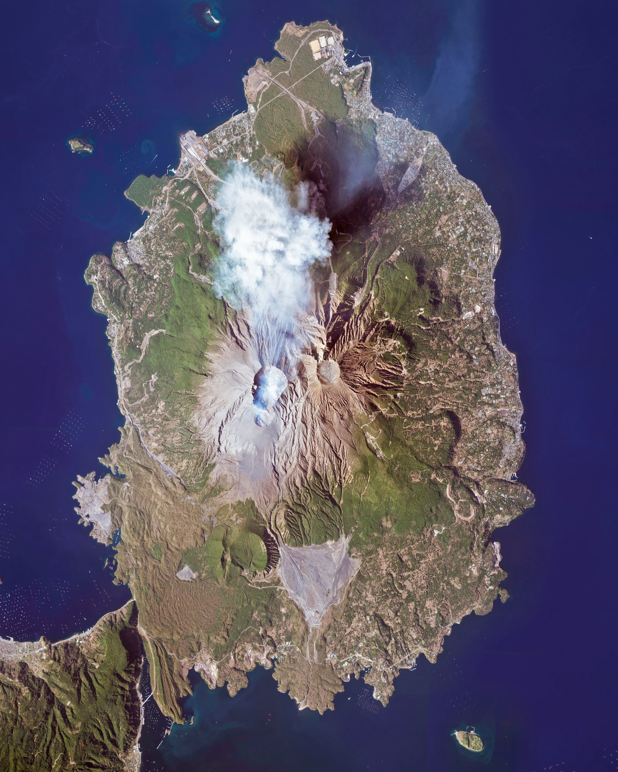 Sakurajima is an active stratovolcano and a former island in Kyushu, Japan. Lava flows from the volcano’s 1914 eruption connected it with the Osumi Peninsula, as shown in the bottom left of this Overview. Since 1955, Sakurajima has been erupting almost constantly, producing thousands of small explosions every year. 31°35'00.0"N, 130°39'00.0"E Source imagery: DigitalGlobe