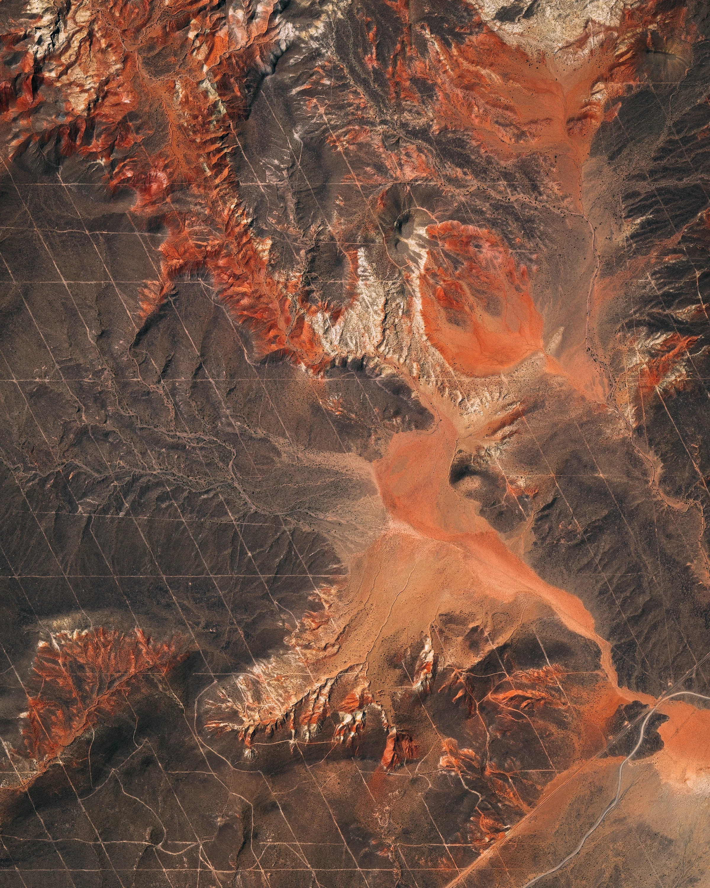 Roads create a grid-like pattern on the landscape in a remote section of Argentina’s Mendoza Province. This area has an arid climate and receives anywhere from 4 to 20 inches (100-500 mm) of precipitation per year. These conditions cause much of the soil to be dry and reddish, as shown in this Overview. 37°02'06.2"S, 69°27'05.9"W Source imagery: DigitalGlobe