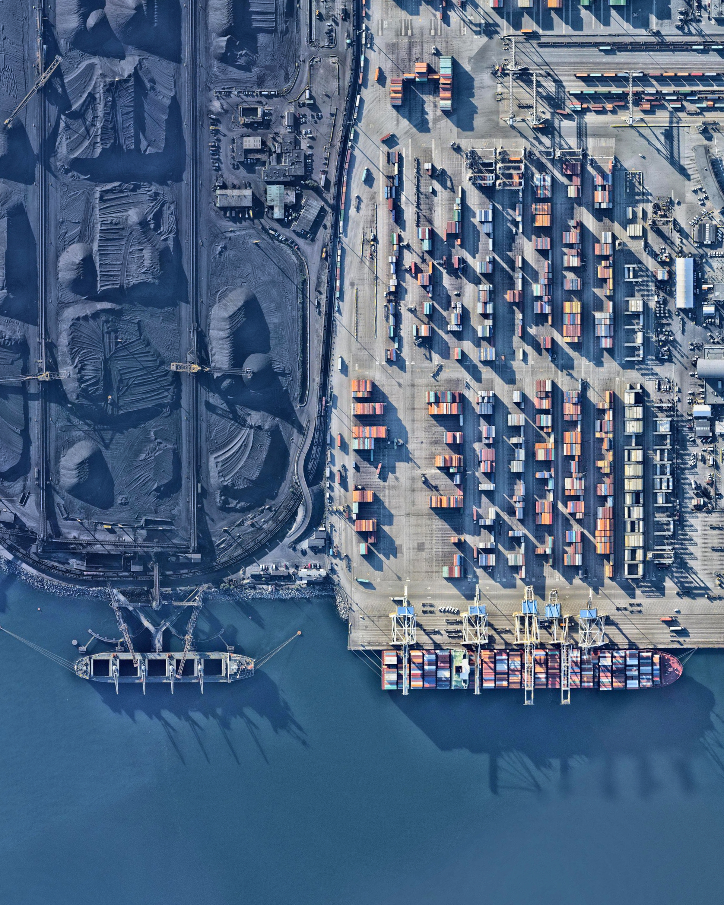 The Roberts Bank Superport is a shipping facility in the Port of Vancouver, just offshore the city of Delta in British Columbia, Canada. It is home to the single busiest coal export terminal in North America, which typically ships more than 20 million tons of export coal a year. Currently, there are plans to expand the facility and add a new three-berth container terminal, which would provide an additional 2.4 million twenty-foot equivalent units of container capacity. 49°01'04.4"N, 123°09'34.5"W Source imagery: Nearmap