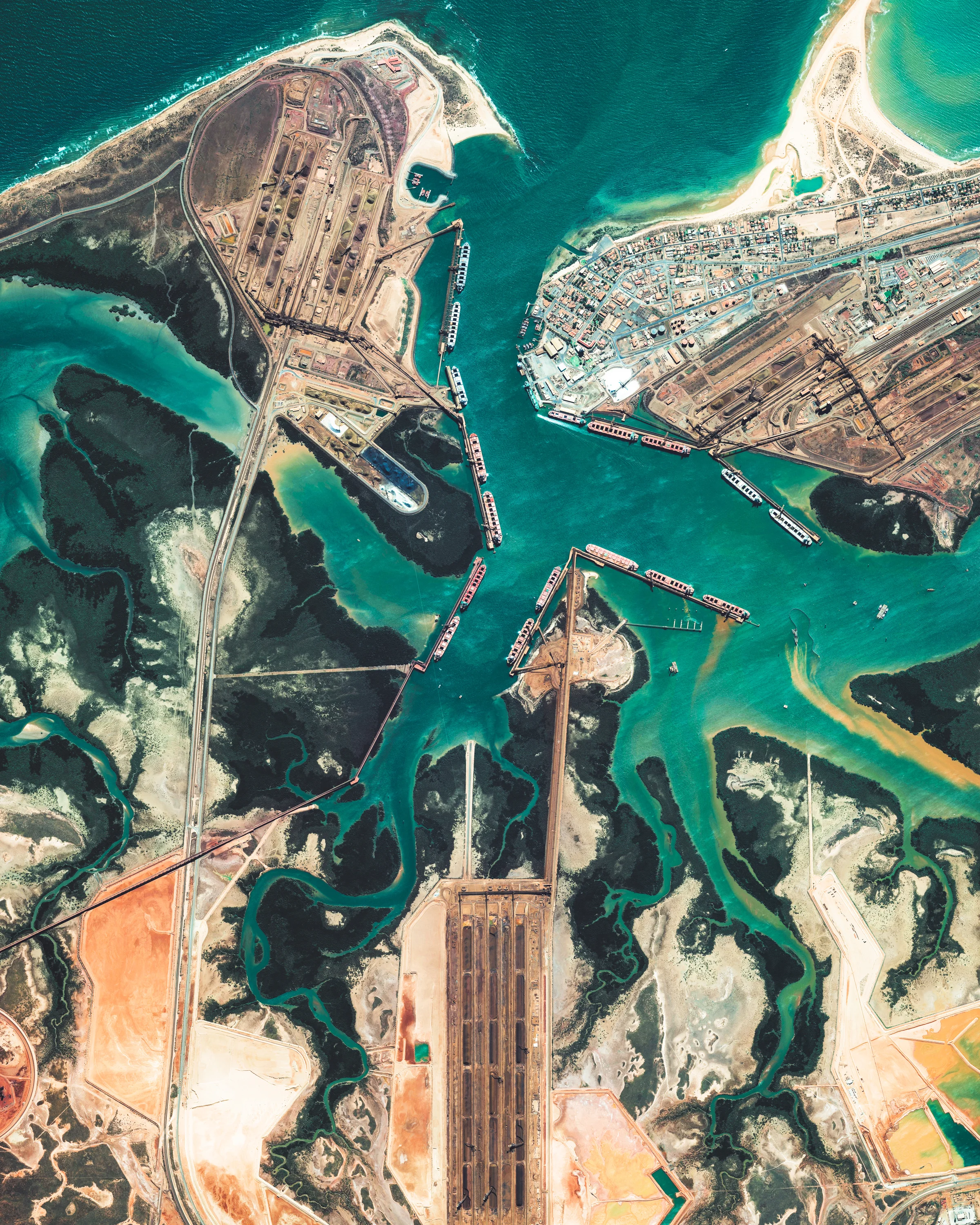 Port Hedland is the largest iron ore loading port in Australia and one of the largest in the world. Located in the Pilbara Region of Western Australia, the port recorded a throughput of more than 550 million tons between 2016 and 2017. In March 2017, Port Hedland had its record single shipment of 297,000 tons, which was aboard the HL Tubarao, an 1,115-foot-long (340 m) vessel from Panama. 20°19'49.7"S, 118°34'09.4"E Source imagery: DigitalGlobe