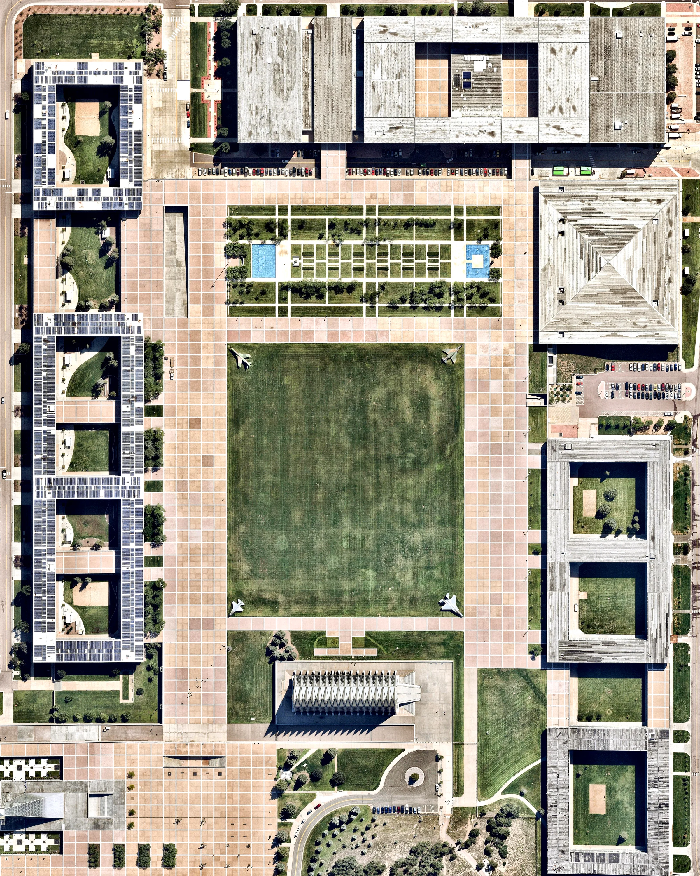 The United States Air Force Academy covers 29 square miles (75 sq. km) in Colorado Springs, Colorado. This segment of the campus, known as the Cadet Area, features the well-known Cadet Chapel, dormitories, academic buildings, and dining, entertainment and sports facilities. At the center of the Cadet Area is a large, grassy common area known as The Terrazzo. 39°00'30.5"N, 104°53'19.2"W Source imagery: Nearmap