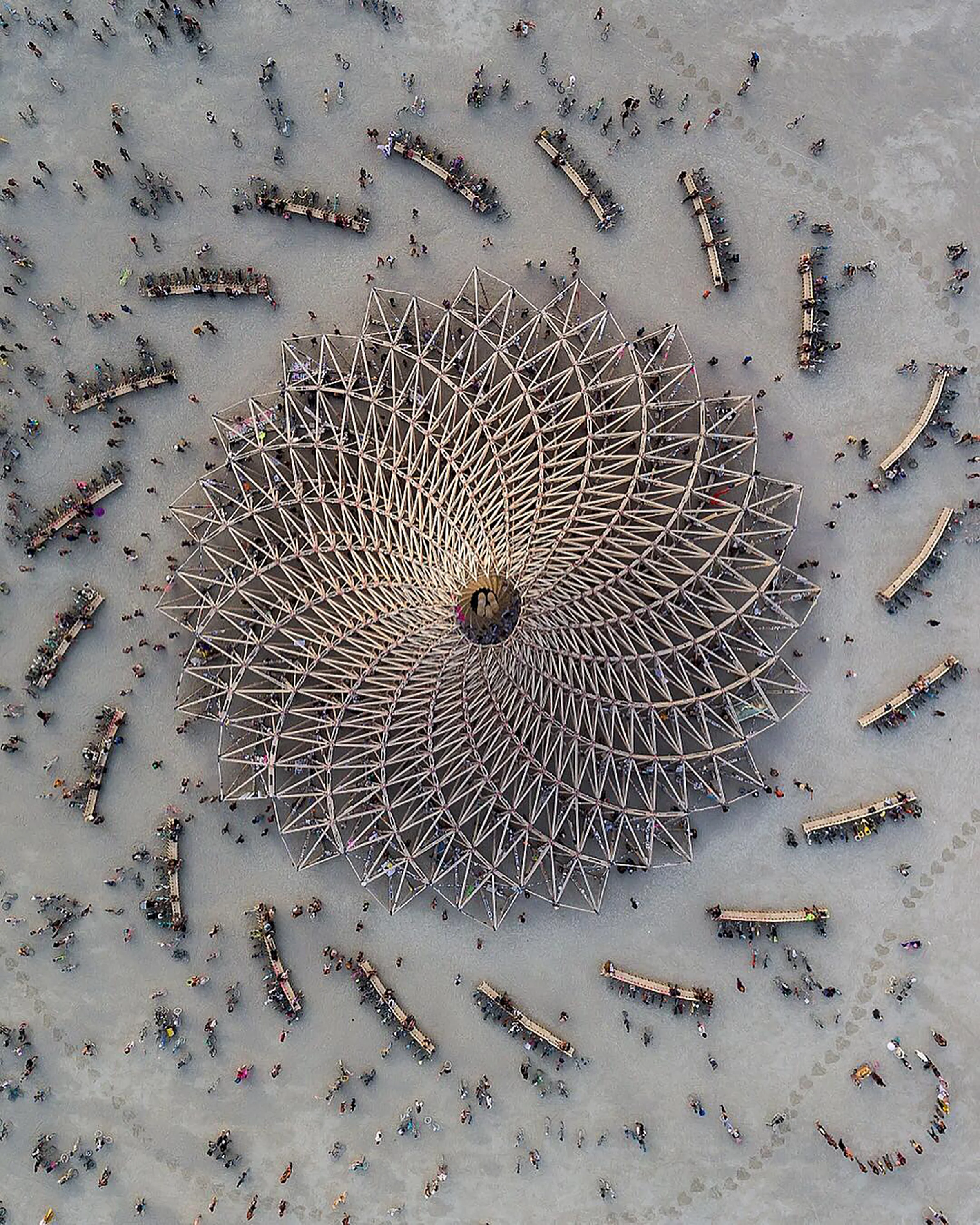 “Galaxia” was The Temple at this year’s Burning Man Festival in the Black Rock Desert of Nevada. Designed by French architect Arthur Mamou-Mani, it is shaped of 20 timber trusses converging as a spiral towards one point in the sky. According to the artist, the design “celebrates hope in the unknown, stars, planets, black holes, the movement uniting us in swirling galaxies of dreams.” 40°47'13.2"N, 119°12'21.6"W Source imagery: Alex Medina Photography