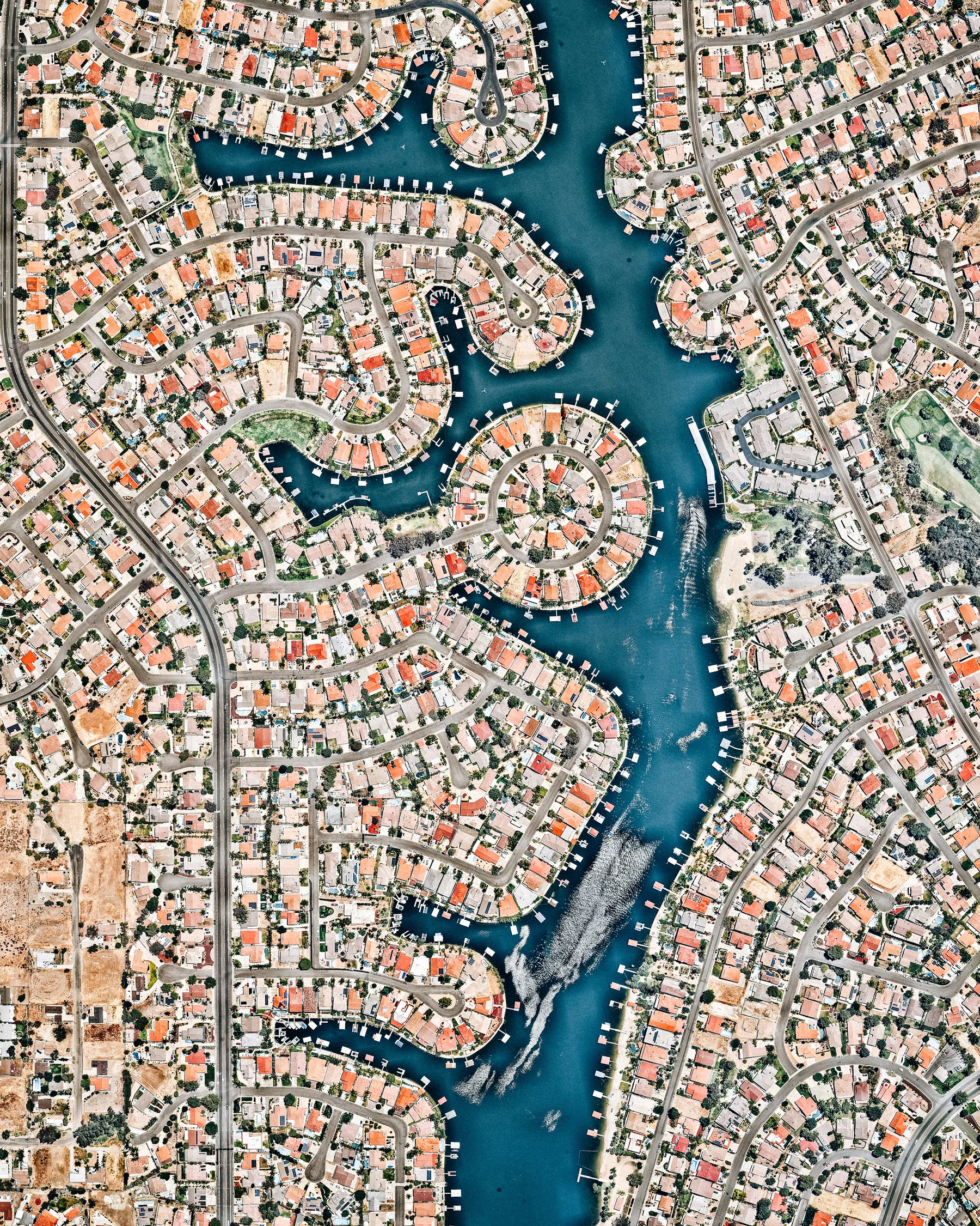 Canyon Lake is a city and gated community in southern California, with a population of slightly more than 11,000 people. Constructed as a master-planned community in 1968, it is one of just five gated cities in the state. In 2006, it was featured in “United Gates of America,” a BBC documentary that explored why people live in gated communities and what effects it has on them. 33°40'53.2"N, 117°15'01.4"W Source imagery: Nearmap