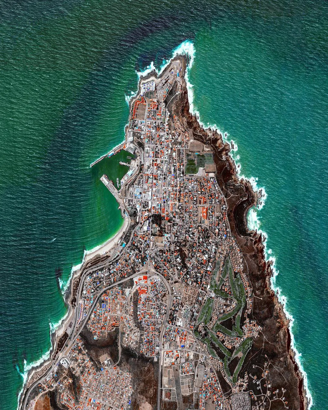 Mossel Bay is located on the Cape St. Blaize Peninsula, jutting off of South Africa into the Indian Ocean. The harbor town is home to roughly 130,000 people and is recognized as a center for both tourism and agriculture. 34°11'06.2"S 22°08'25.8"E Source imagery: DigitalGlobe