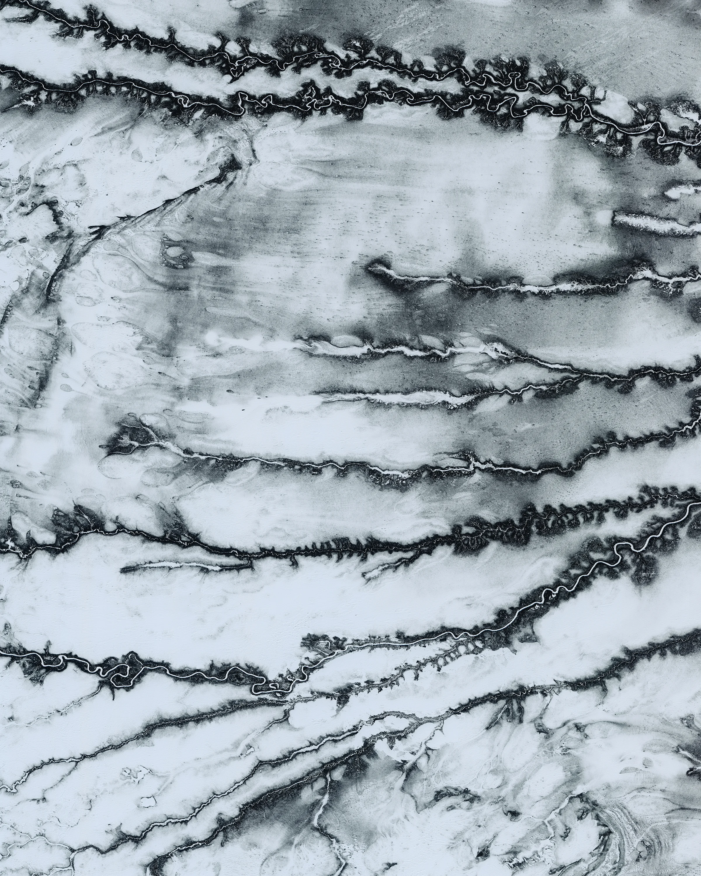 Tributaries of the Moose River snake across snowy terrain near Moosonee, a town in northern Ontario, Canada. This area is part of the Hudson Plains Ecozone, a sparsely populated subarctic region extending from the western coast of Quebec to the coast of Manitoba. The ecozone contains the largest continuous wetland in the world, including the Moose River’s 41,900-square-mile (108,500 sq. km) drainage basin. 51°04'26.3"N, 81°28'28.6"W Source imagery: DigitalGlobe