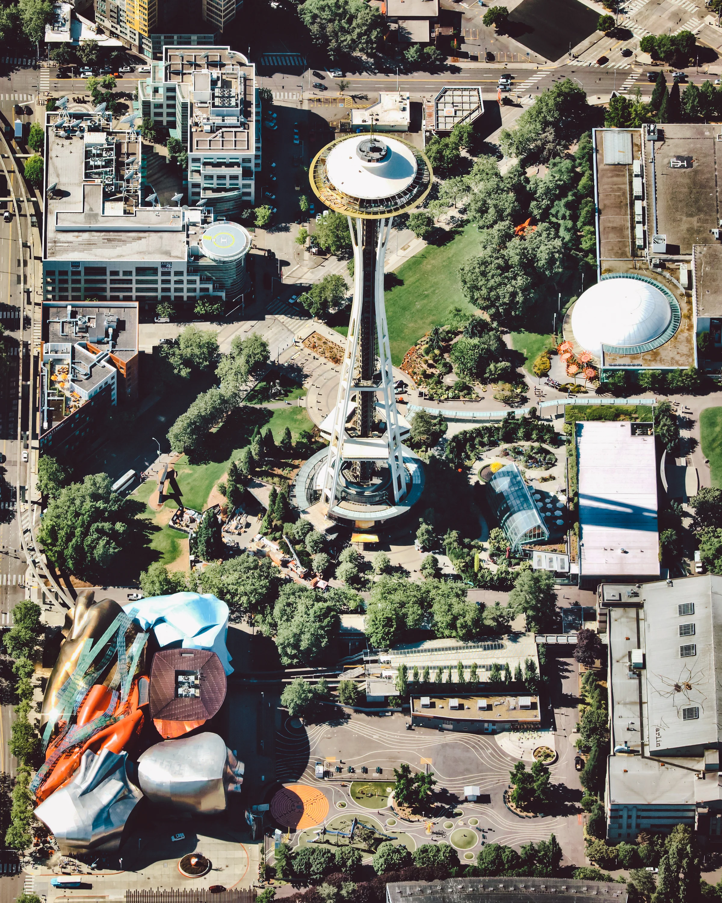 Seattle Center is an arts, educational, tourism and entertainment center in Seattle, Washington. Its landmark feature is the 605-foot (184 m) tall Space Needle, an observation tower that has become a symbol of the city. Other attractions shown in this Overview include the Museum of Pop Culture (bottom left) and the Seattle Children’s Museum (bottom right). 47°37'13.4"N, 122°20'56.8"W Source imagery: Nearmap