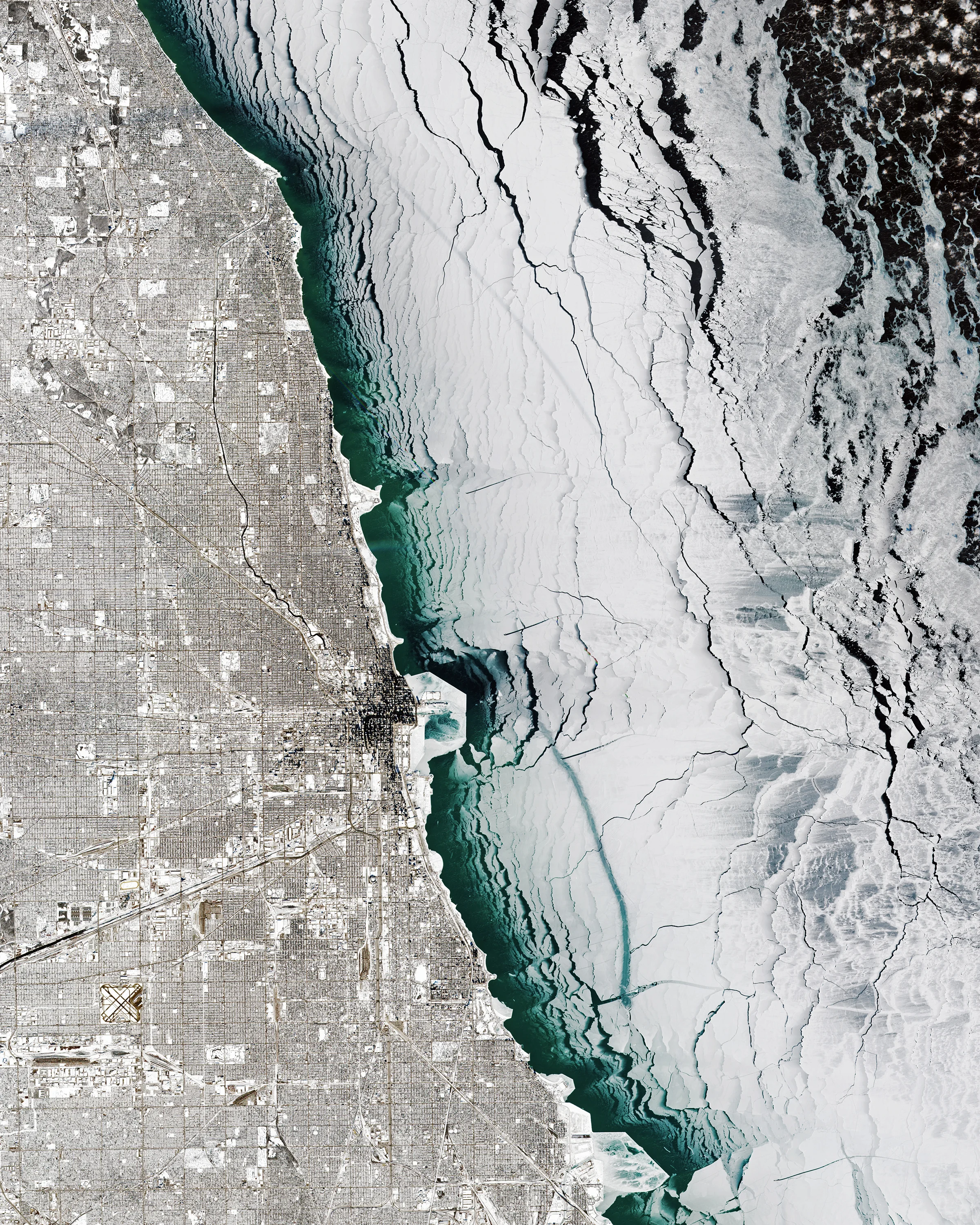 Check out this amazing Overview of Chicago, Illinois, and Lake Michigan during last week's polar vortex. Captured Thursday by the European Space Agency's Sentinel-2 satellite, it shows the entire city covered in snow with massive chunks of lake ice floating offshore. Chicago finished off the month of January with 13 consecutive days of snow and some of its coldest temperatures in more than three decades. 41°50'13.0"N, 87°41'05.0"W Source imagery: ESA - European Space Agency via Descartes Labs