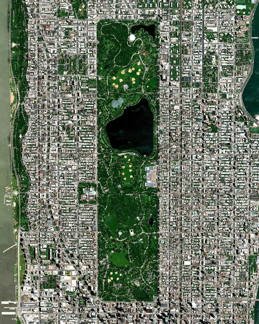 This Overview captures Central Park in New York City. Located in the middle of Manhattan, the park spans 843 acres — or 6% of the borough. One of the most influential innovations in the park's design was its "separate circulation" systems for pedestrians, horseback riders, and automobiles. This concealed "crosstown" commercial traffic in sunken roadways (known as "transverses" today), and densely planted shrub belts in order to maintain a rustic ambiance. 40°46'56.0"N, 73°57'55.0"W Source imagery: DigitalGlobe