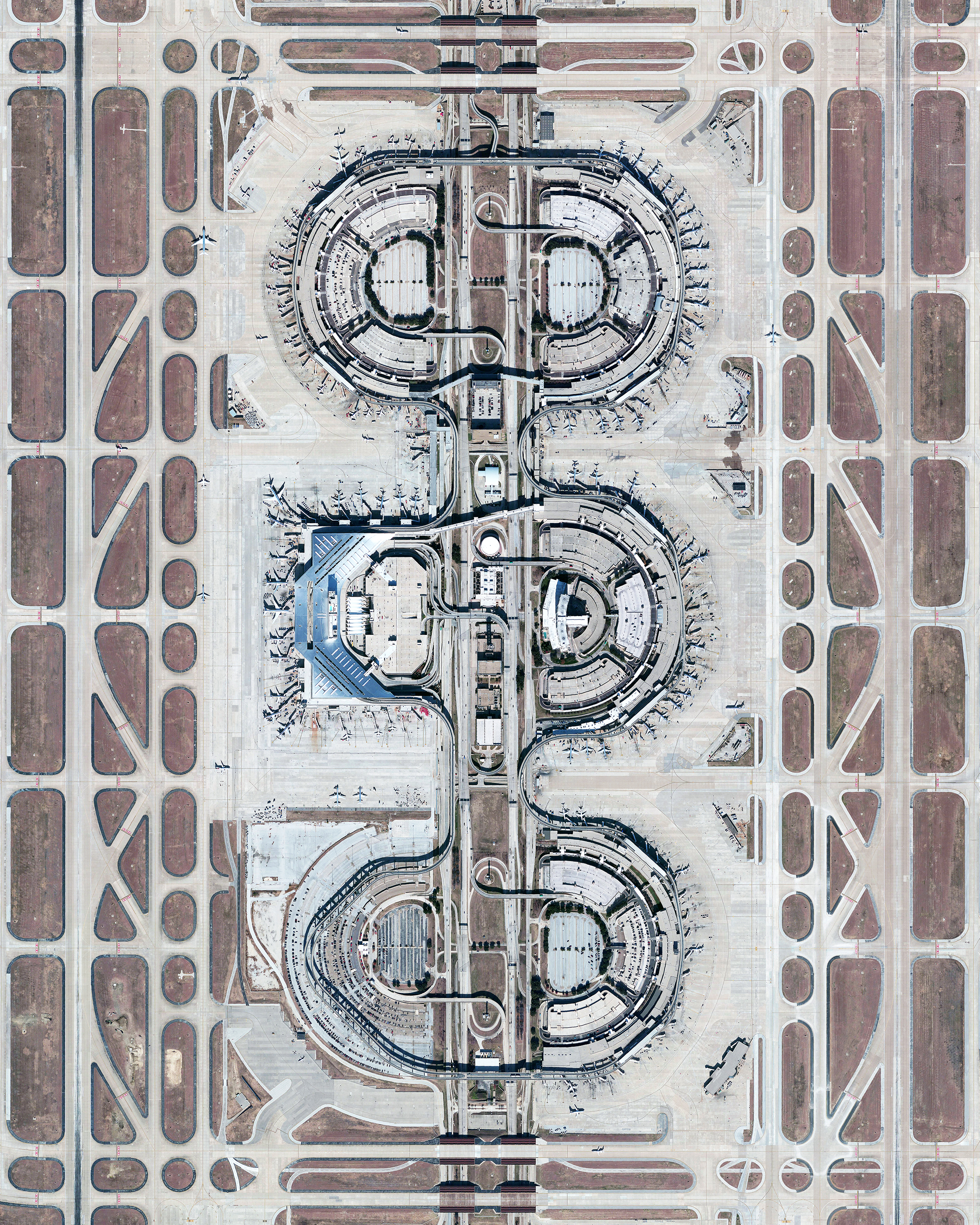 Dallas/Fort Worth International Airport covers more than 27 square miles (70 sq. km) in Texas — an area larger than the island of Manhattan. It is the fourth busiest airport in the world by aircraft movements and the 14th busiest in the world in terms of passenger traffic, handling 69.1 million travelers in 2018. 32°53'49.0"N, 97°02'17.0"W Source imagery: DigitalGlobe