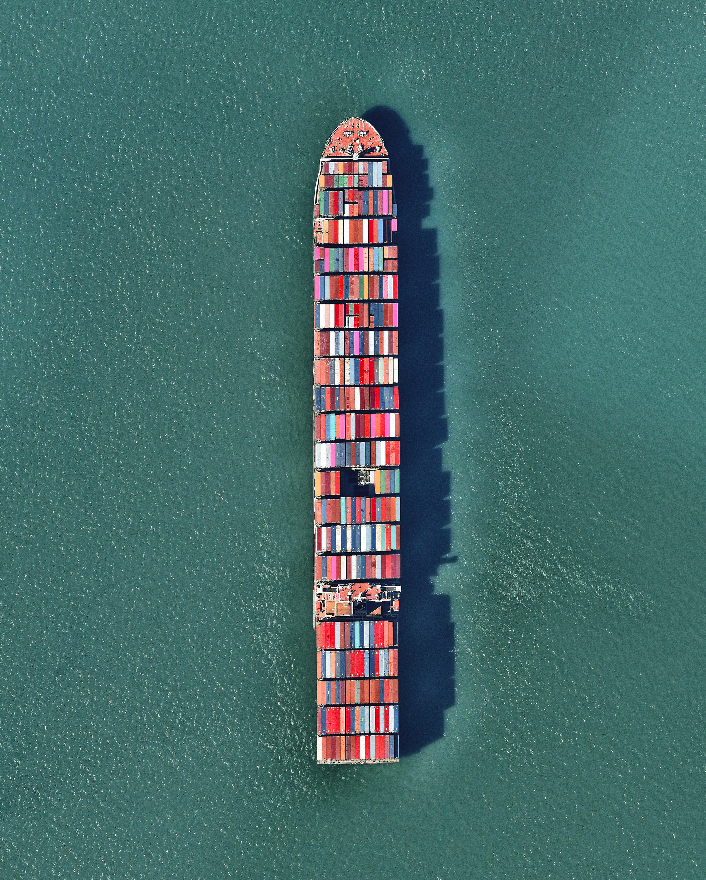 A ship full of containerized cargo navigates San Francisco Bay, located between San Francisco and Oakland, California. Due to San Francisco's limited real estate, Oakland has served as the primary Bay Area port since the 1960s. The Port of San Francisco handled no containerized cargo in 2017, whereas the Port of Oakland had a throughput of nearly 2.5 million twenty-foot equivalent units (TEUs) that year. 37°46'01.3"N, 122°20'58.3"W Source imagery: Nearmap