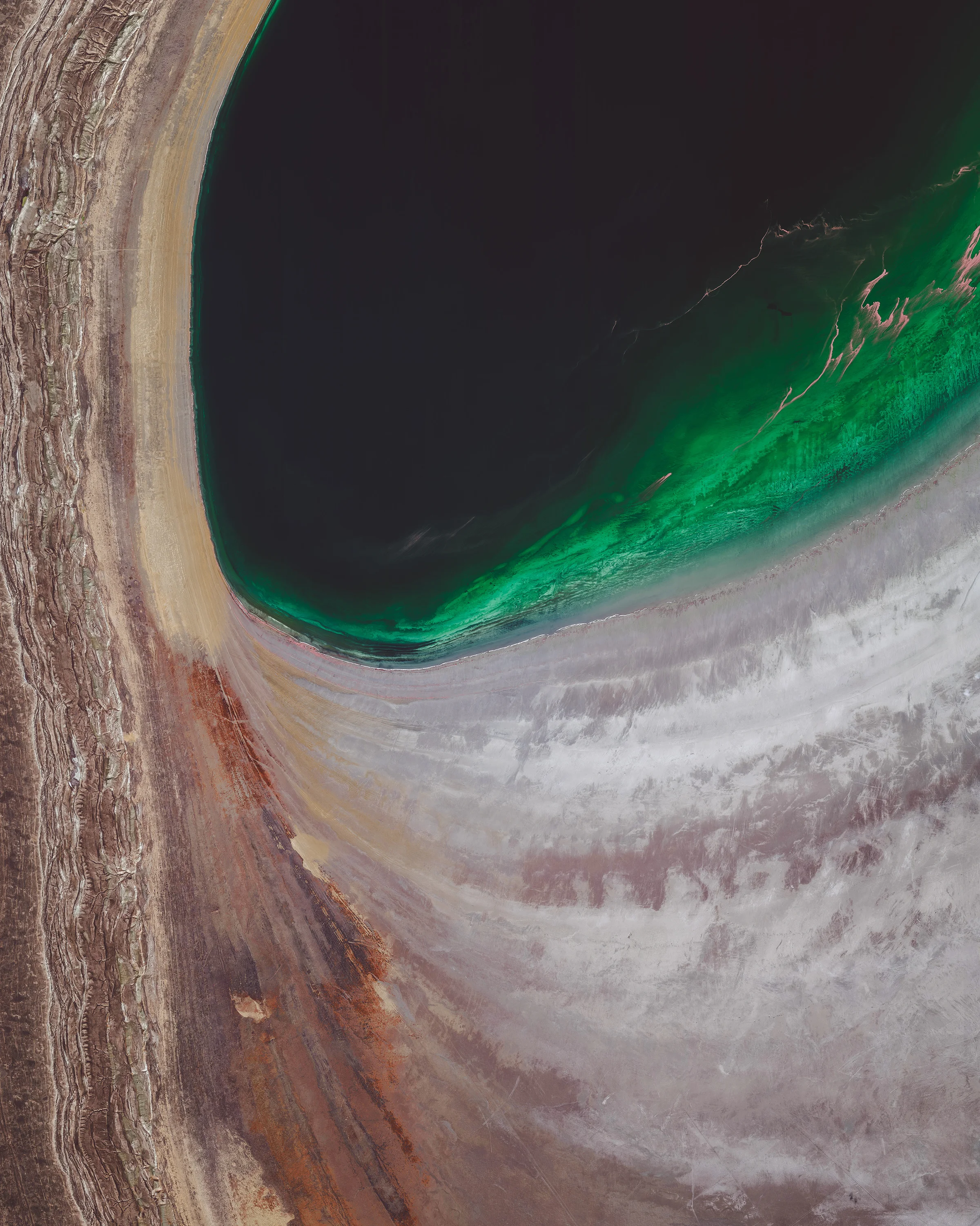 The Aral Sea was an endoheic lake (one with no outflow) located between Kazakhstan and Uzbekistan. Once the fourth largest lake in the world with an area of 26,300 square miles (68,000 sq. km), it has been shrinking since the 1960s after rivers that fed it were diverted by Soviet irrigation projects. By 1997, it had declined to 10% of its original size and split into four lakes, one of which has since disappeared. The shrinking of the Aral Sea has been called one of the planet's worst environmental disasters. 46°00'30.9"N, 59°17'39.8"E Source imagery: DigitalGlobe