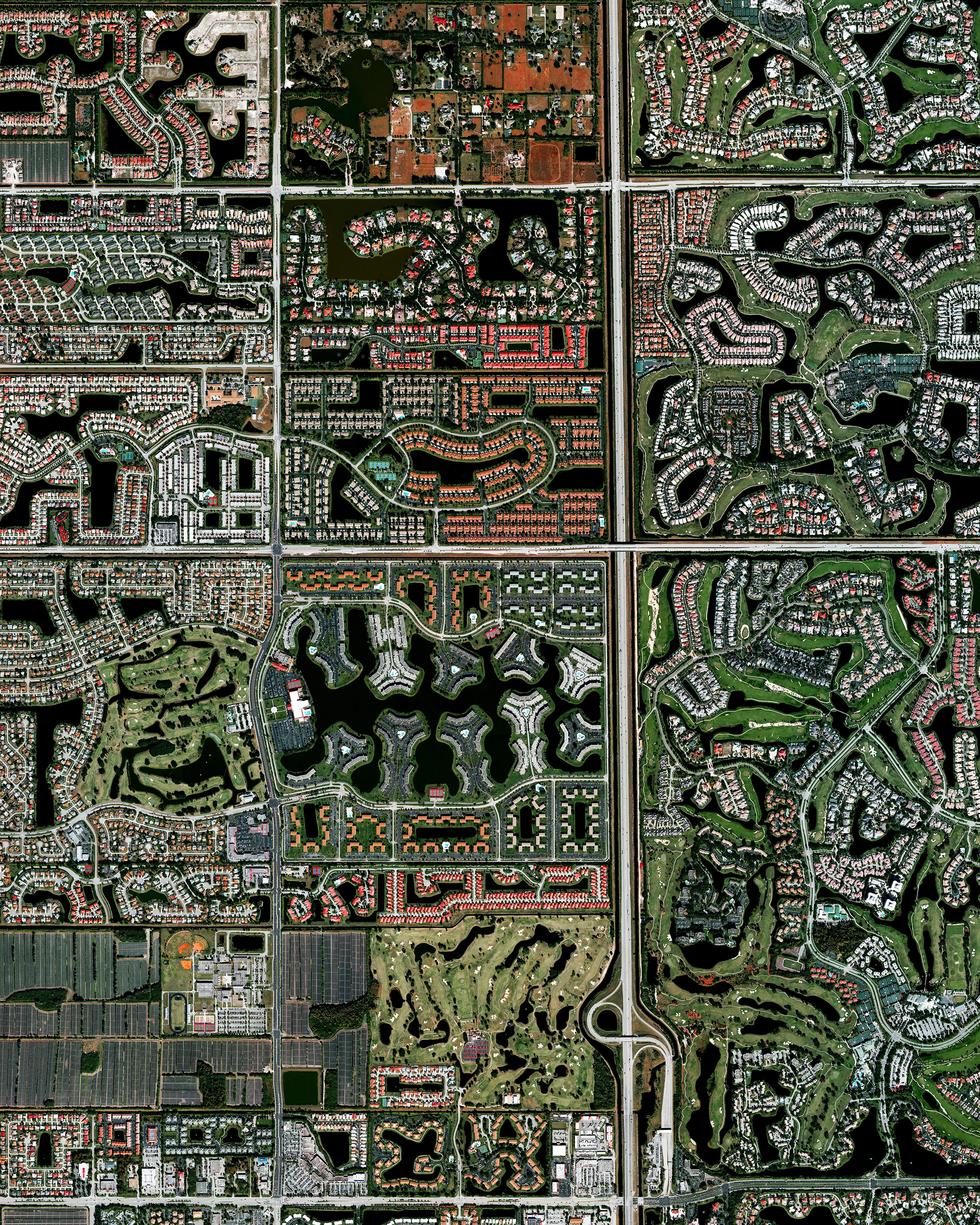 Residential development is seen in Boca Raton, Florida, USA. Because many cities in the state contain master-planned communities, often built on top of waterways in the latter half of the twentieth century, there are a number of intricate designs that are visible from the Overview perspective. Boca Raton is home to roughly 91,000 residents. 26°23'10.8"N, 80°10'47.7"W Source imagery: DigitalGlobe