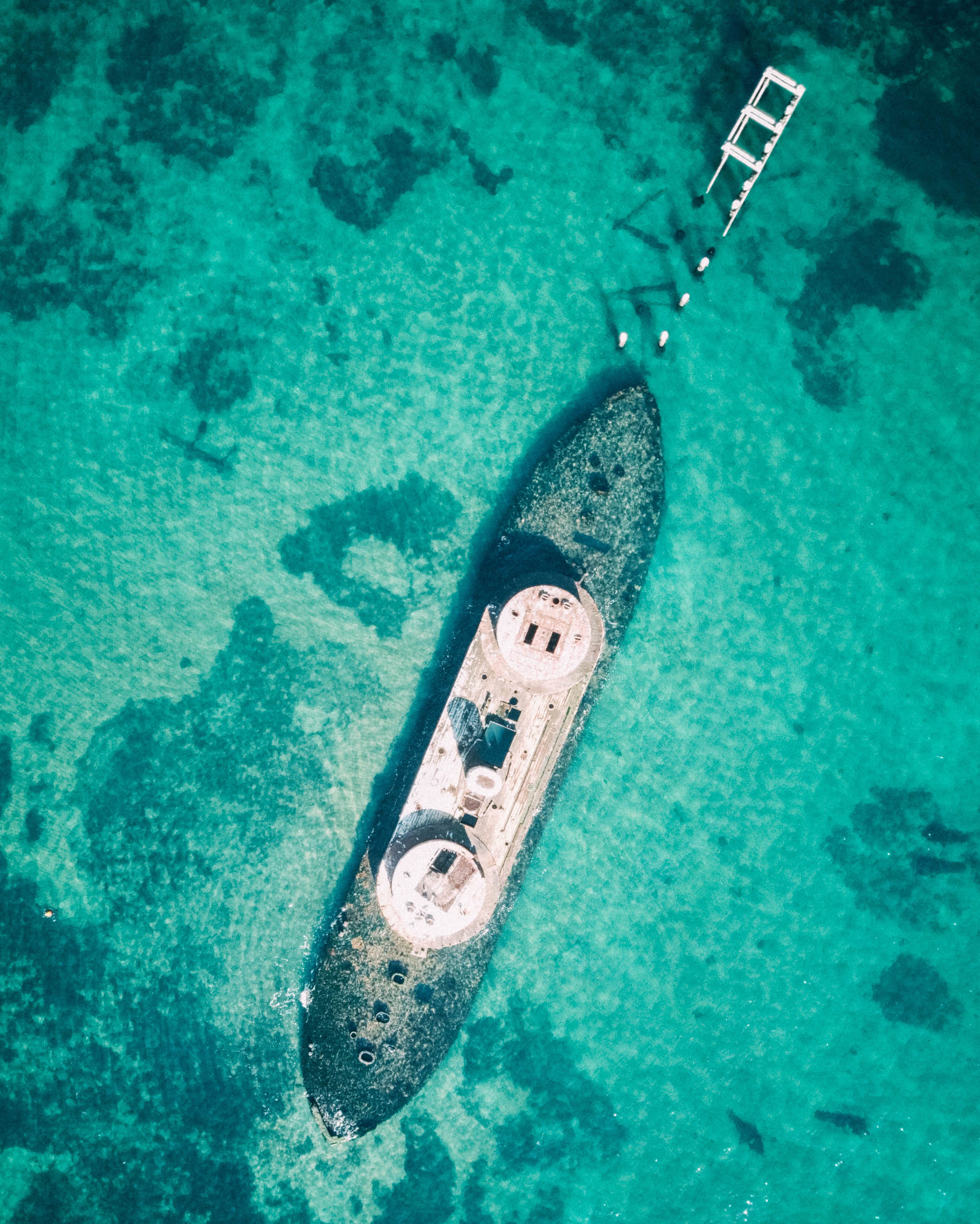 The HMVS Cerberus (Her Majesty's Victorian Ship) was scuttled in 1926 to serve as a breakwater on Half Moon Bay, just southeast of Melbourne, Australia. Before it was deliberately sunk, it served in the Victoria Naval Forces, Commonwealth Naval Forces and the Royal Australian Navy from 1871 to 1924. Sitting in about 10 feet (3 m) of water roughly 650 feet (200 m) from shore, the Cerberus is now a popular site for scuba diving and has been used as a training site for combat swimmers. 37°58'02.8"S 145°00'28.7"E Source imagery: Kieren Andrews Photography