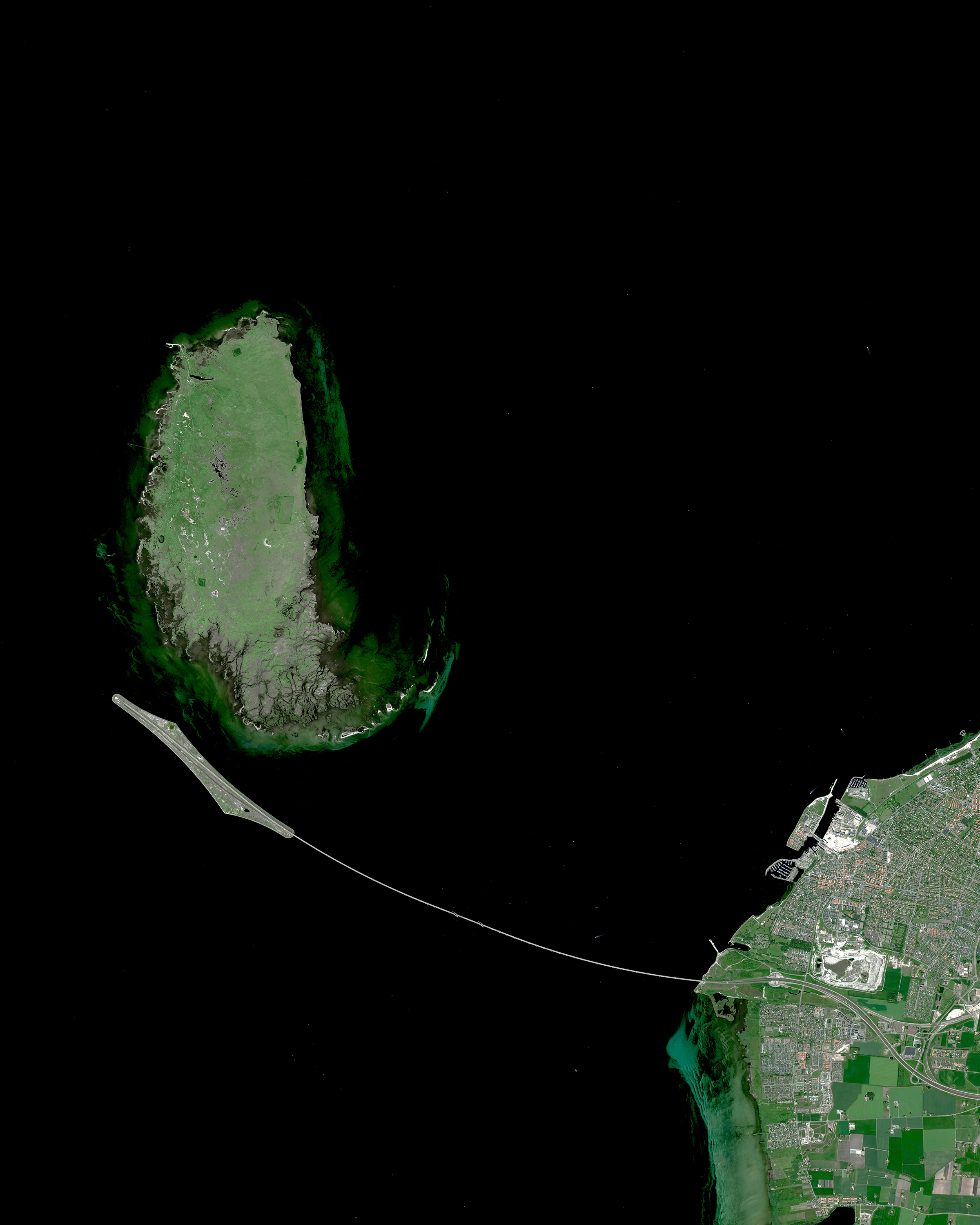 Stretching nearly 5 miles, the Øresund Bridge is the longest combined road and rail bridge in Europe. The bridge, which then becomes a tunnel, joins together two metropolitan areas — the Danish capital city of Copenhagen and the Swedish city of Malmö. The bridge itself has a mass of 82,000 tonnes and supports two railway tracks and four road lanes. 55°34'12.0"N 12°51'00.0"E Source imagery: Maxar Technologies
