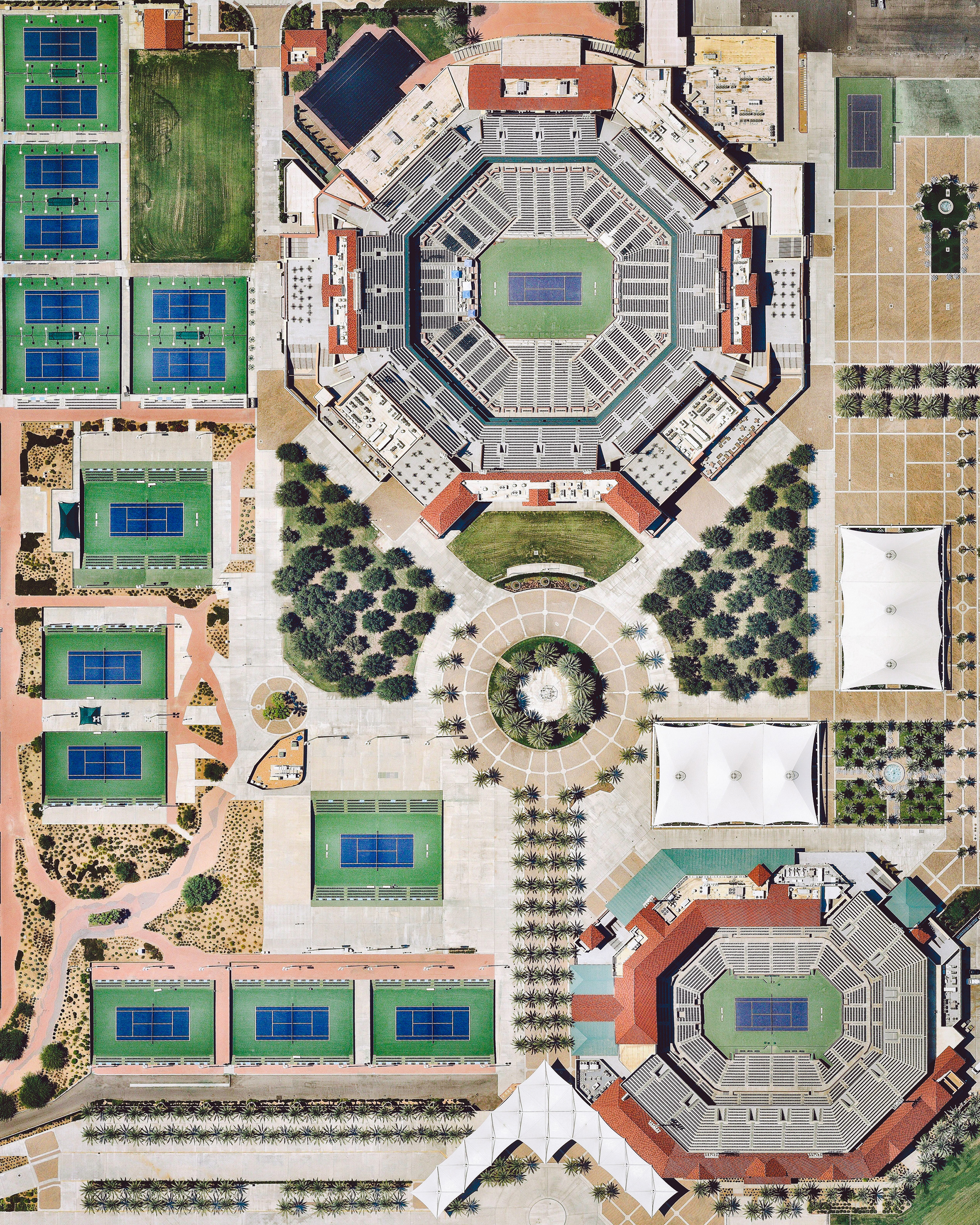 The Indian Wells Tennis Garden is a 29-court complex located on 88 acres (360,000 sq. m) near Palm Springs, California. Its 16,000-capacity "Stadium 1" is the second largest outdoor tennis stadium in the world. Every year, the complex hosts the Indian Wells Masters, also known as the BNP Paribas Open — the best-attended tennis tournament outside of the four Grand Slam tournaments. 33.723541, -116.304663 Source imagery: Nearmap