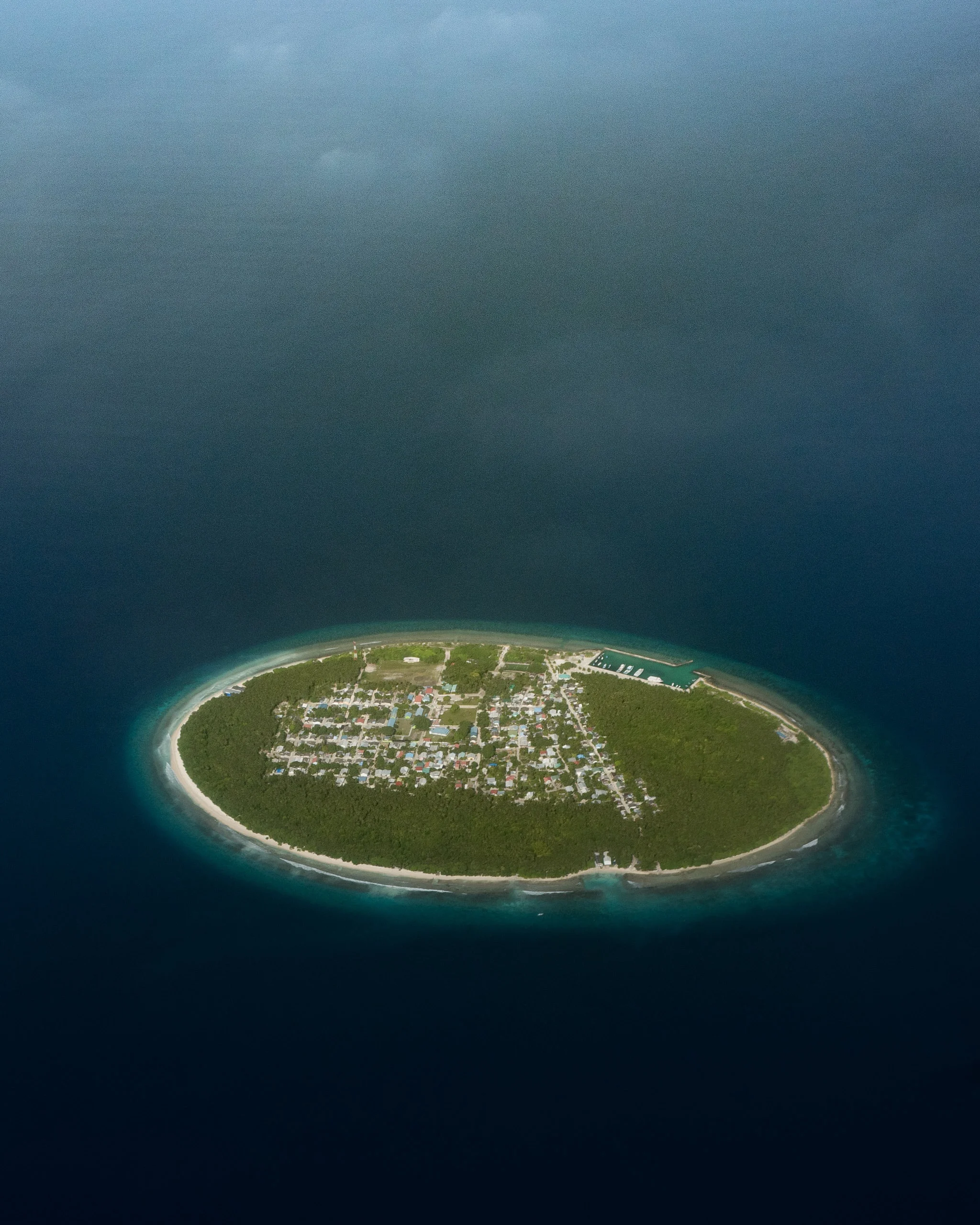 Foakaidhoo is one of 16 inhabited islands in the Shaviyani Atoll of the Maldives. Covering an area of about 0.25 square miles (0.66 square km) in the Arabian Sea, it is home to roughly 1,320 people. The island has several privately-owned shops, a health center, a school for children in preschool through grade 10, and other basic community centers. 6.326389°, 73.149167° Source imagery: Ahmed Saffu