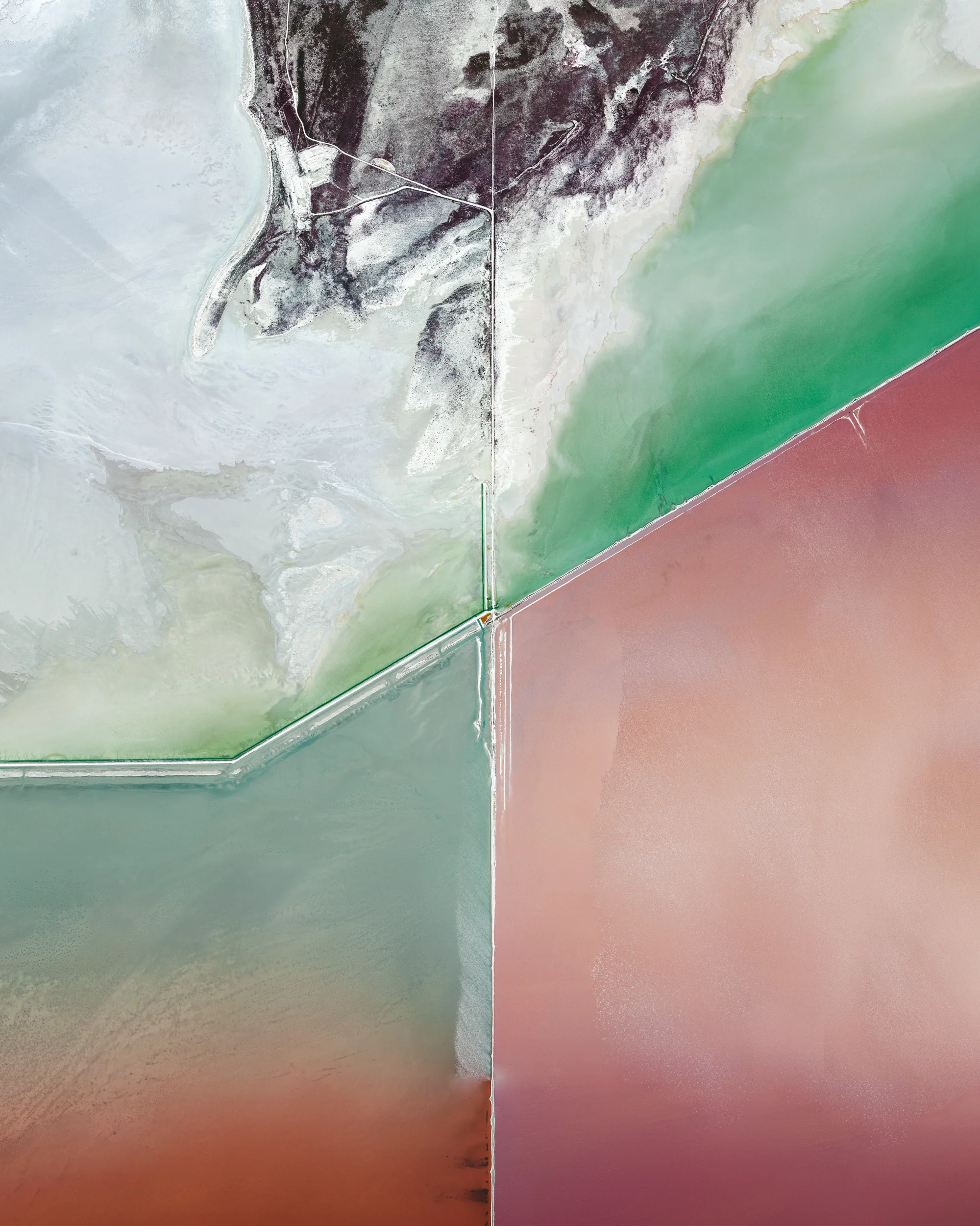 Evaporation ponds in the Great Salt Lake, Utah, are shown in this Overview. The Great Salt Lake contributes an estimated $1.3 billion annually to Utah’s economy, including $1.1 billion from industry, which is mostly due to mineral extraction. Minerals extracted from the lake include sodium chloride, potassium sulfate, and magnesium-chloride. 40.792722°, -112.592889° Source imagery: Maxar Technologies