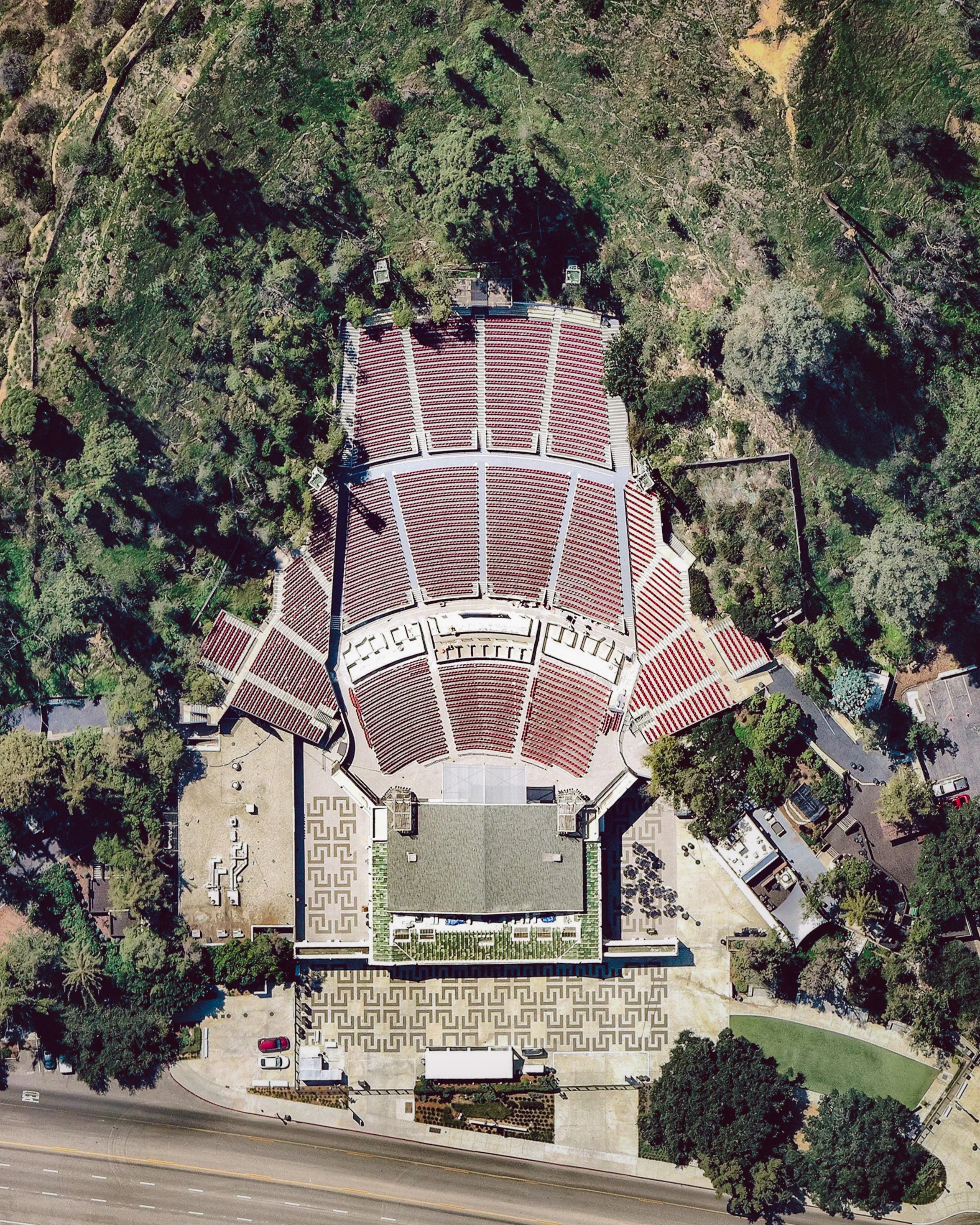 Greek Theatre is a 5,870-seat music venue in Griffith Park, Los Angeles, California. The venue hosted its first show in June 1931, selling seats in the first two sections for a dollar a piece and giving the remaining seats away for free. Since then, it has featured some big names in music — including Elton John, Aretha Franklin, Frank Sinatra, Bruce Springsteen and Carlos Santana. 34.119702°, -118.296065° Source imagery: Nearmap