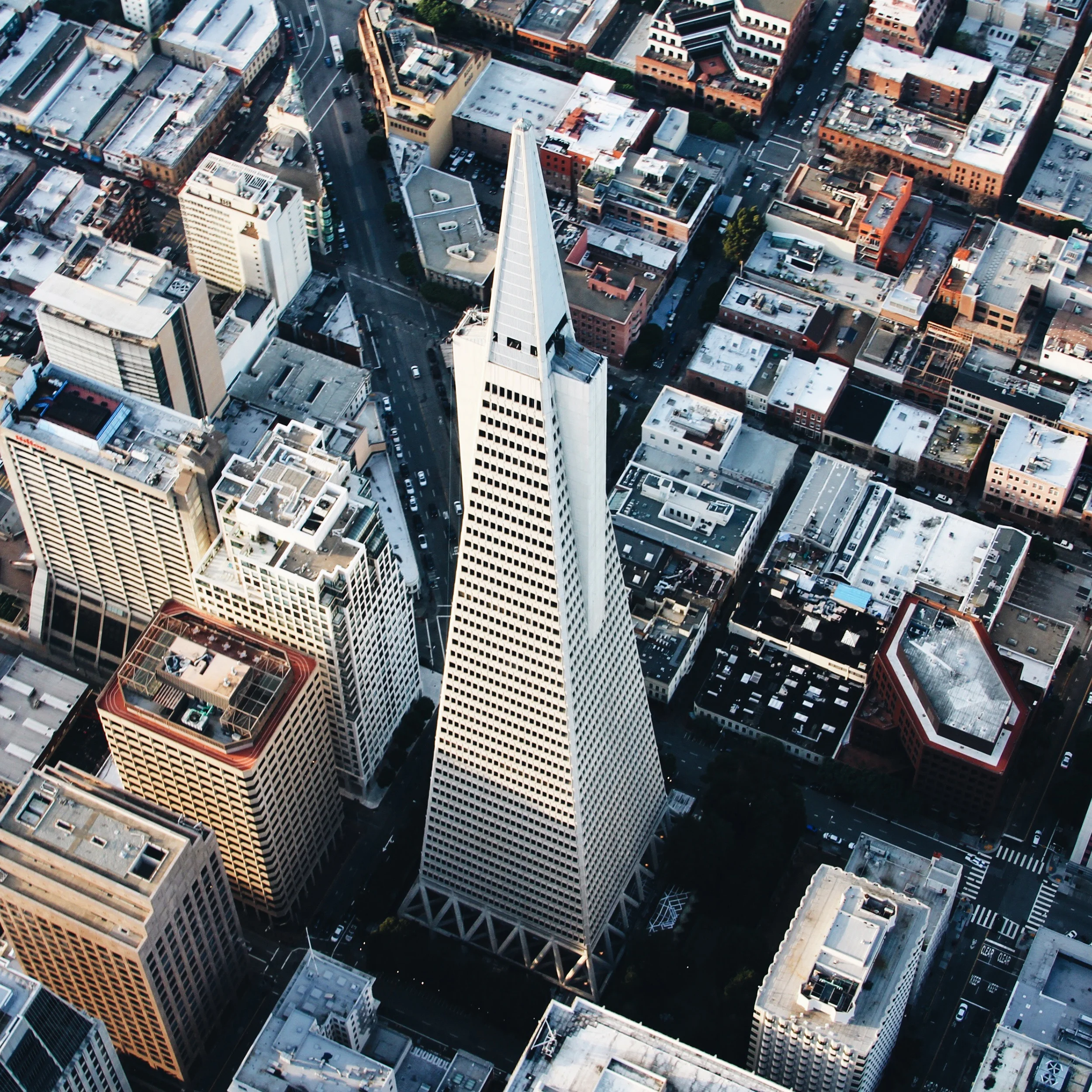 The Transamerica Pyramid is the second-tallest skyscraper in the skyline of San Francisco, California, at 853 feet (260 m). Its design consists of a tall, four-sided pyramid with two "wings" that accommodate an elevator shaft on the east and a stairwell and smoke tower on the west. Four cameras, pointed in the four cardinal directions, are positioned at the top of the building's spire to form the "Transamerica Virtual Observation Deck." 37.795200°, -122.402800° Source imagery: Chris Leipelt Photography