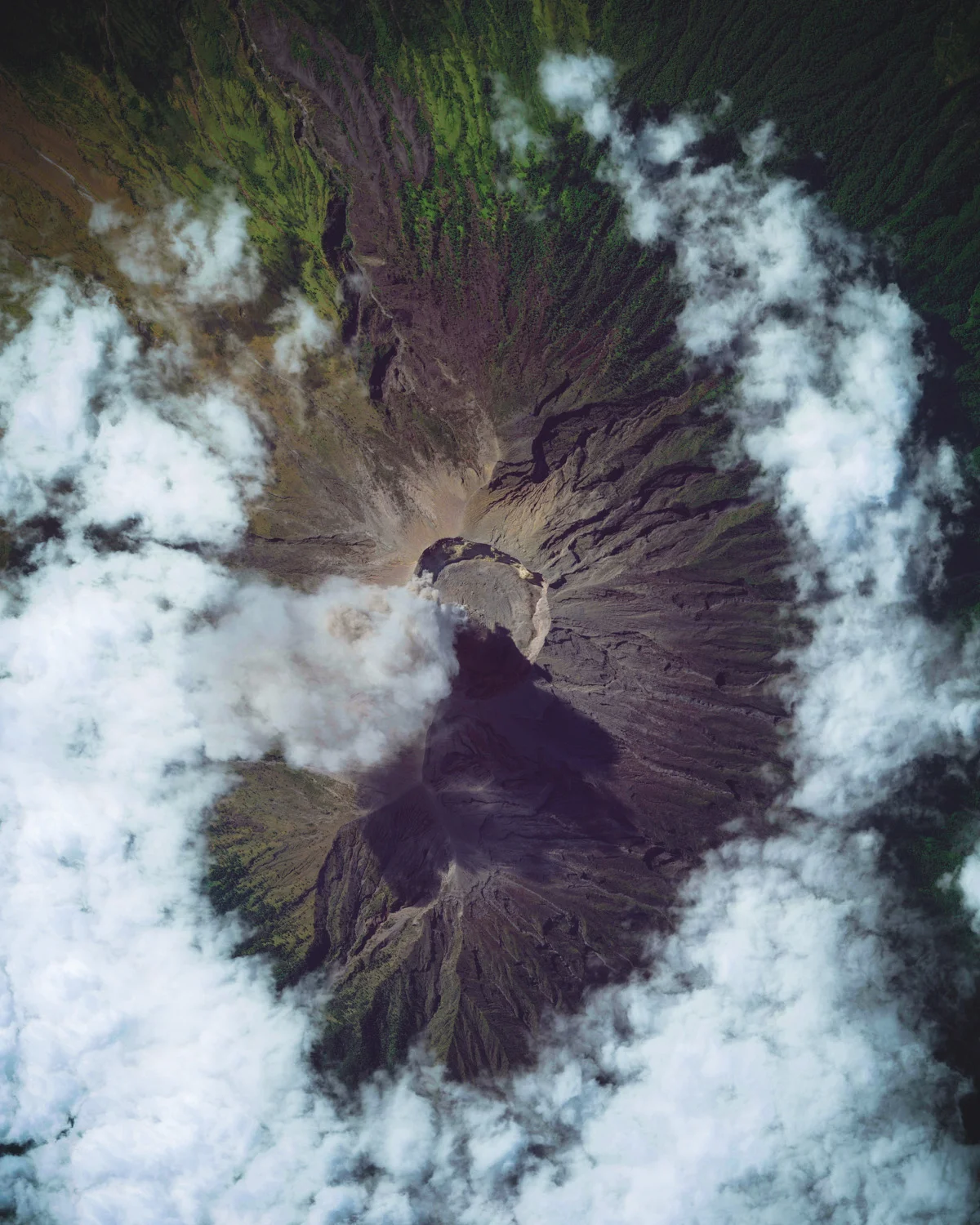 Smoke and ash rise from the summit of Mount Agung, an active volcano in Bali, Indonesia. Having begun in 2017, the volcano’s latest eruption is ongoing and has caused numerous evacuations and international flight delays. At 9,944 feet (3,031 m), Mount Agung is the highest point on Bali and from a distance appears to be perfectly conical. -8.340833°, 115.503333° Source imagery: Maxar Technologies
