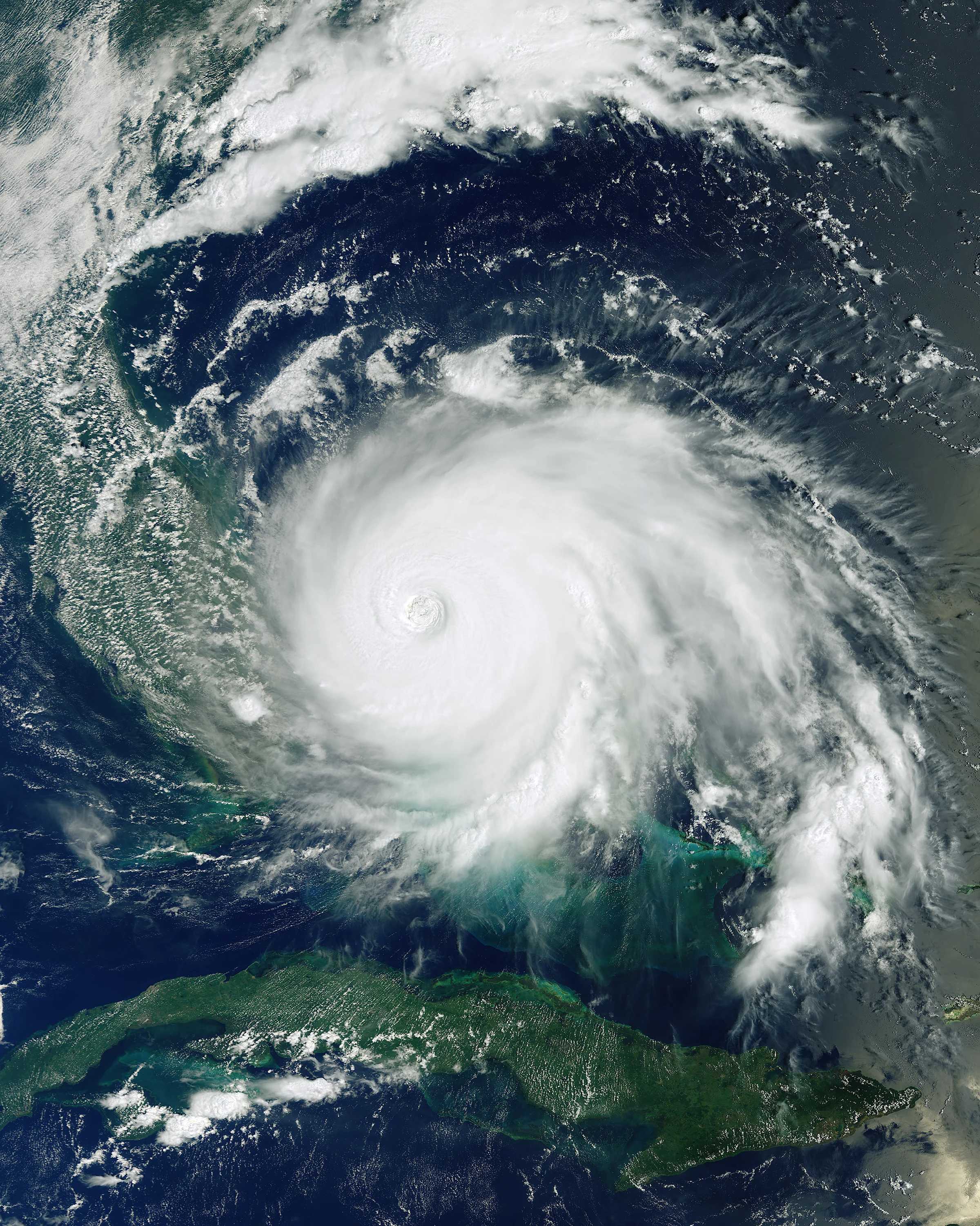 This image, captured by the European Space Agency's Copernicus Sentinel-3 satellite, shows Hurricane Dorian pummeling the Bahamas on Monday, September 2. Having reached Category 5 intensity with sustained winds of 185 mph (295 km/h), the storm is reported to be one of the most powerful Atlantic hurricanes on record. It is currently a Category 2 hurricane and is expected to continue up the southeastern coast of the United States. Several fatalities have been recorded and numerous homes and infrastructure have been destroyed. 24.250000°, -76.000000° Source imagery: ESA - European Space Agency