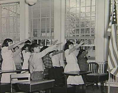 The original pledge of allegiance, 1941, with “the Bellamy salute,” after Francis Bellamy, a nationalist/socialist author who wrote the original pledge in 1892. Francis had like-minded cousins in the brothers Edward and Charles Bellamy. Pre-1900 writings of all three Bellamys are quoted at this website for their confusion of the liberal lexicon.