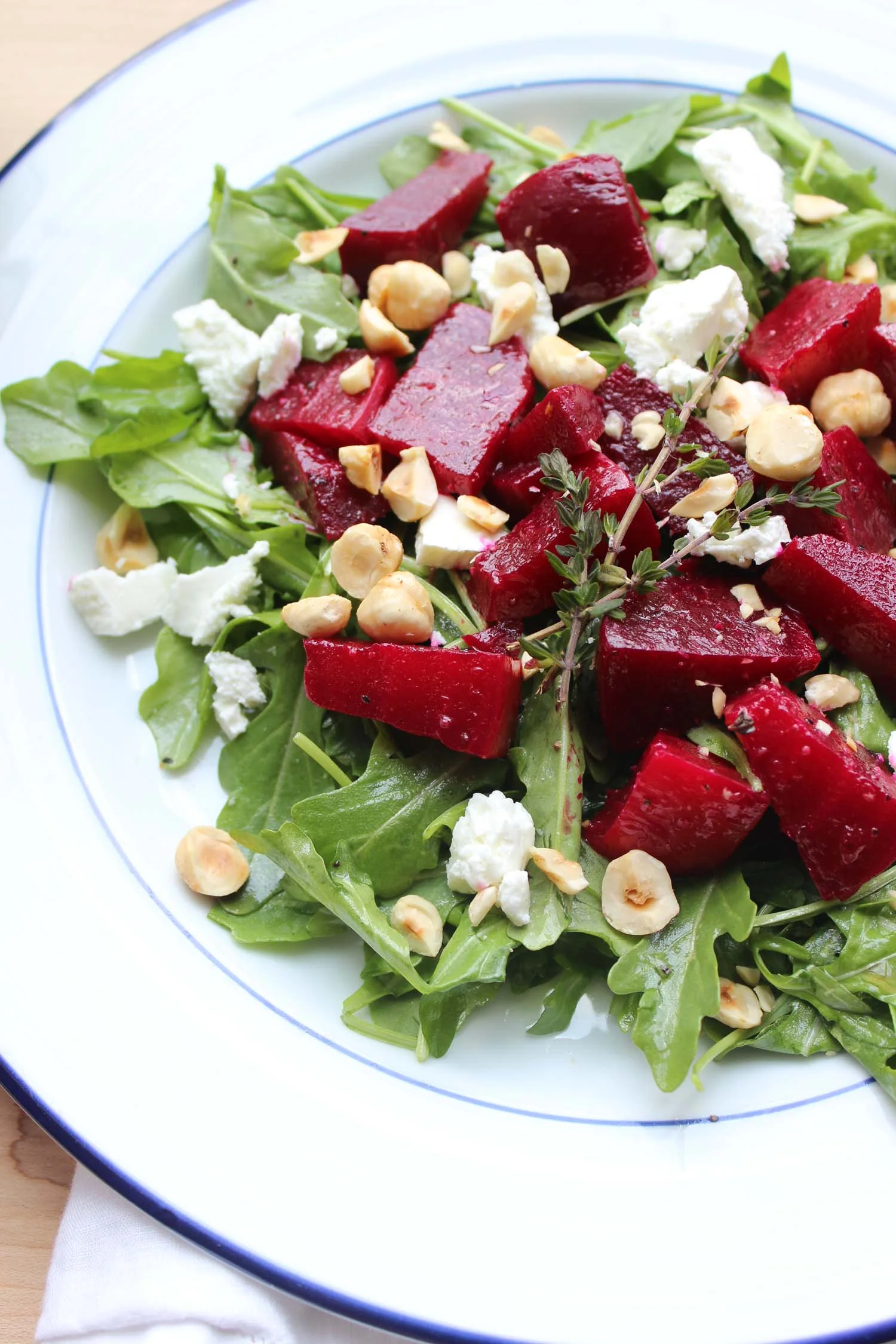 Roasted Beet Salad with Arugula, Goat Cheese and Hazelnuts | Image: Laura Messersmith