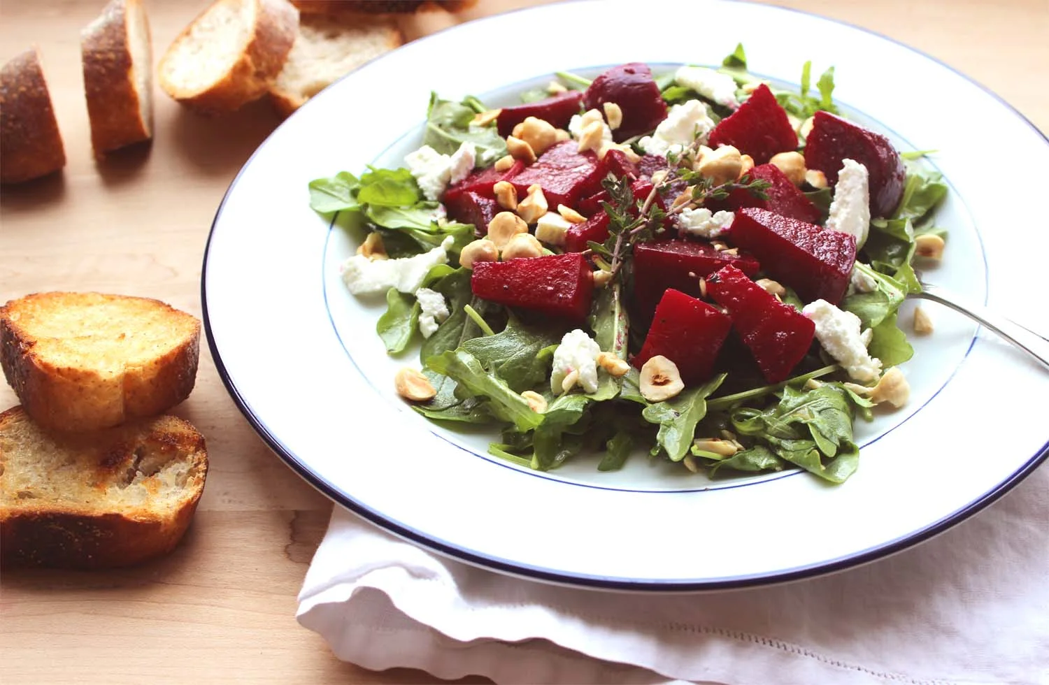 Roasted Beet Salad with Arugula, Goat Cheese and Hazelnuts | Image: Laura Messersmith