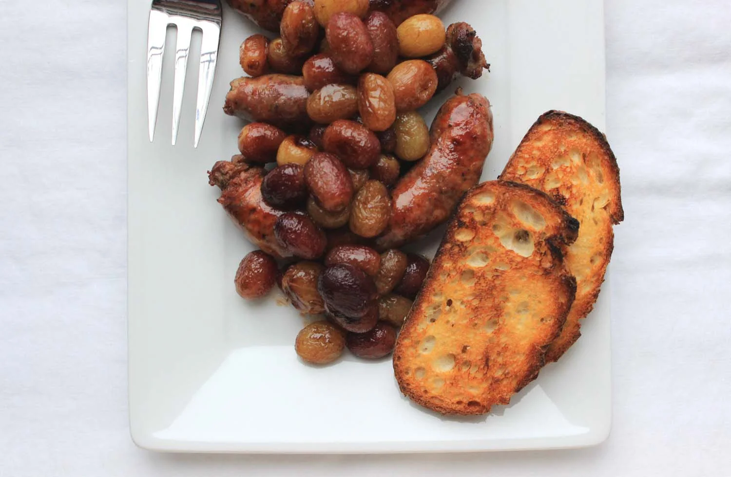 Roasted Sausages and Grapes | Image: Laura Messersmith