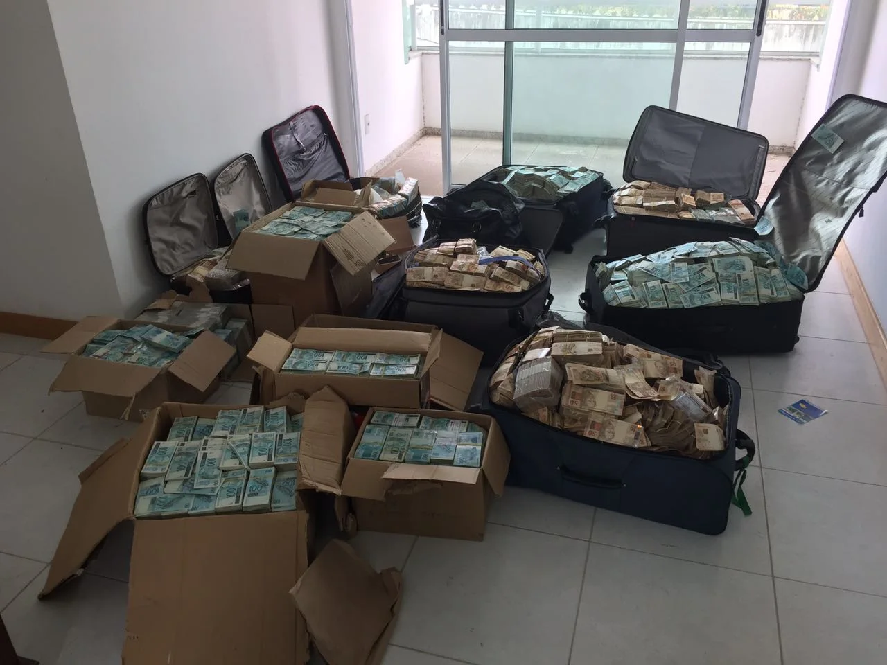 This image of suitcases filled up with money allegedly found stashed in former Finance Minister, Ignatius Chombo’s residence are going around social media.