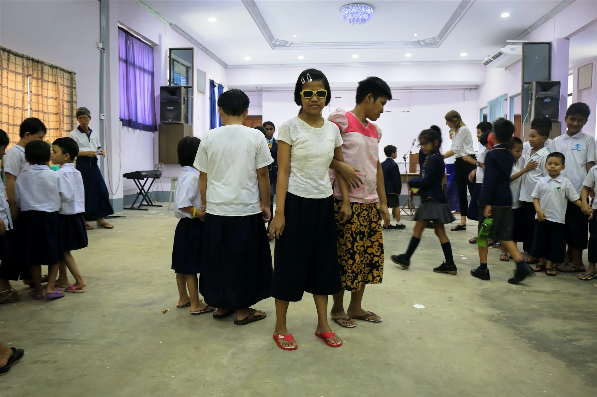 A student stands in the middle of the assembly hall. June 2017