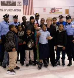 Maureen receiving an award from the Police Athletic League , which serves more than 26,000 kids across Philadelphia.