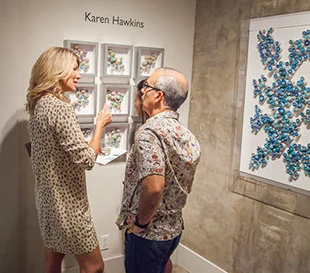 At the 5 DECADES opening, the Austin-based artist talked with Natalie and Paul Bardgjy about “Jelly Melts” (left) and “Once Upon a Time” (right).