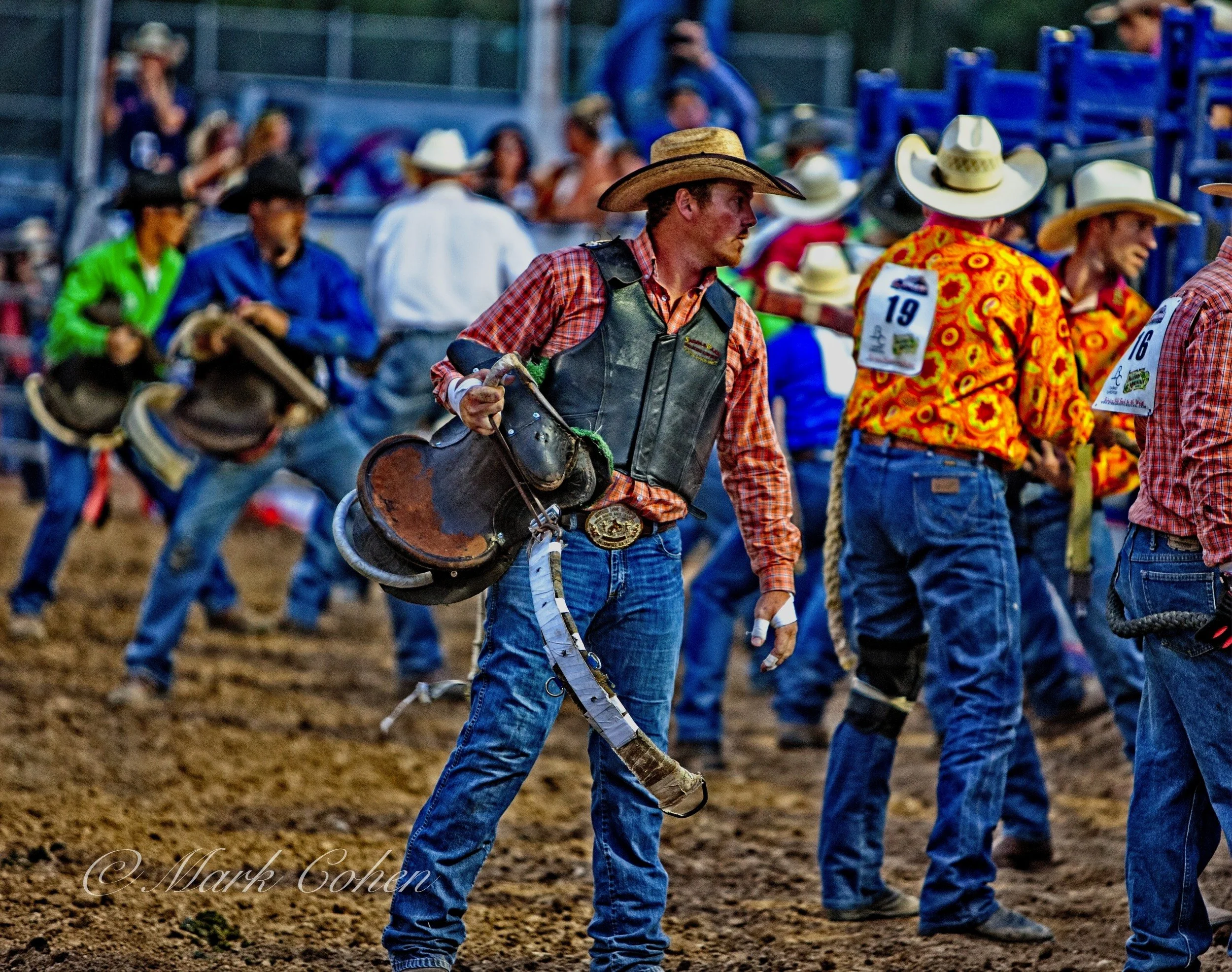Cowboys preparing to ride.jpg