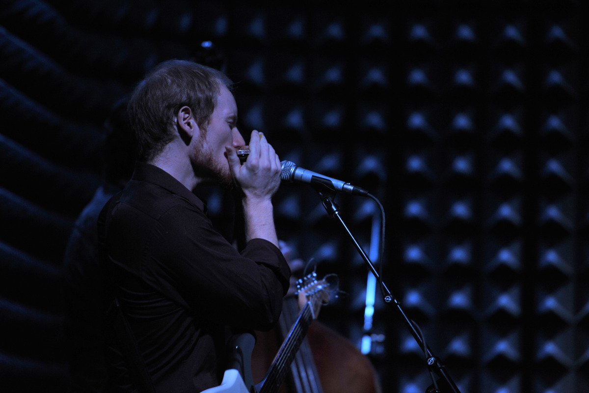 Chris at Joes Pub with harp.jpg