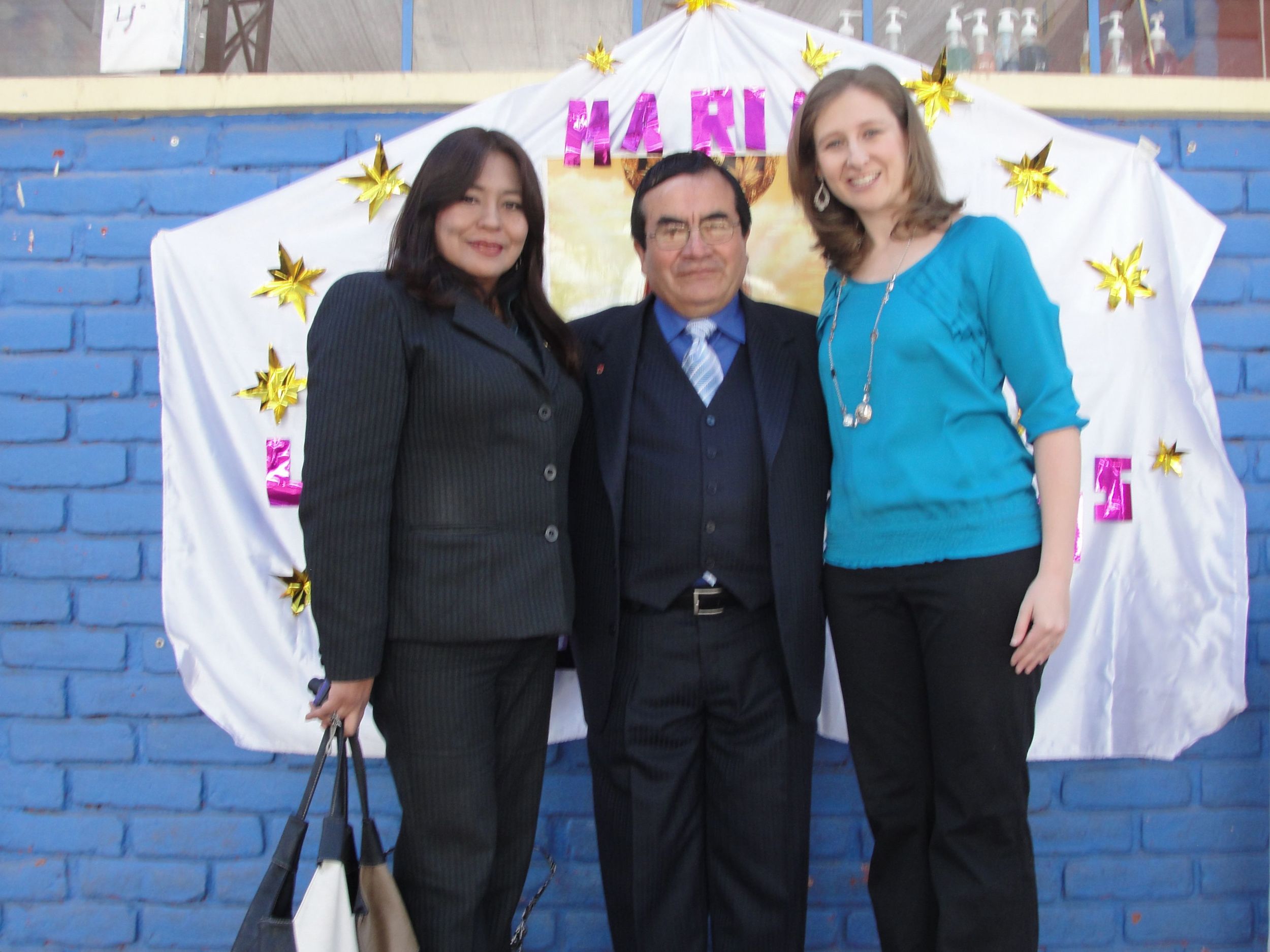 Standing with the minister of education and the director of staff development