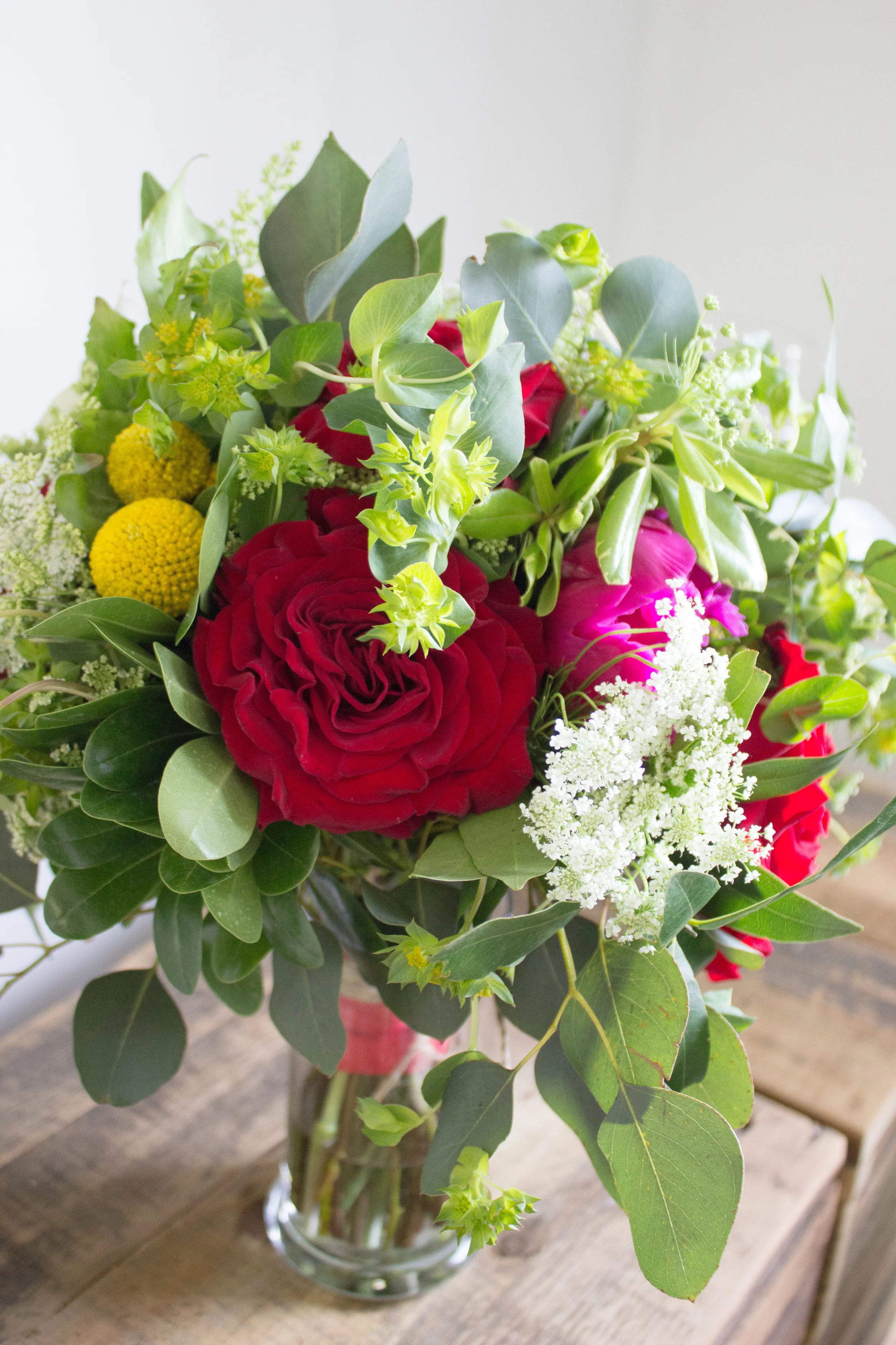 Brides Bouquet: Garden roses, Queen Anne's Lace, Craspedia, Peonies and Various Greens