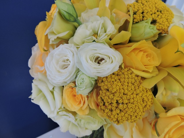 Bridal Bouquet closeup! Roses, lisianthus, calla lillies, yarrow, and orchids. The bridesmaids had something similar without the orchids and callas... Thanks to my cousin David for this shot!