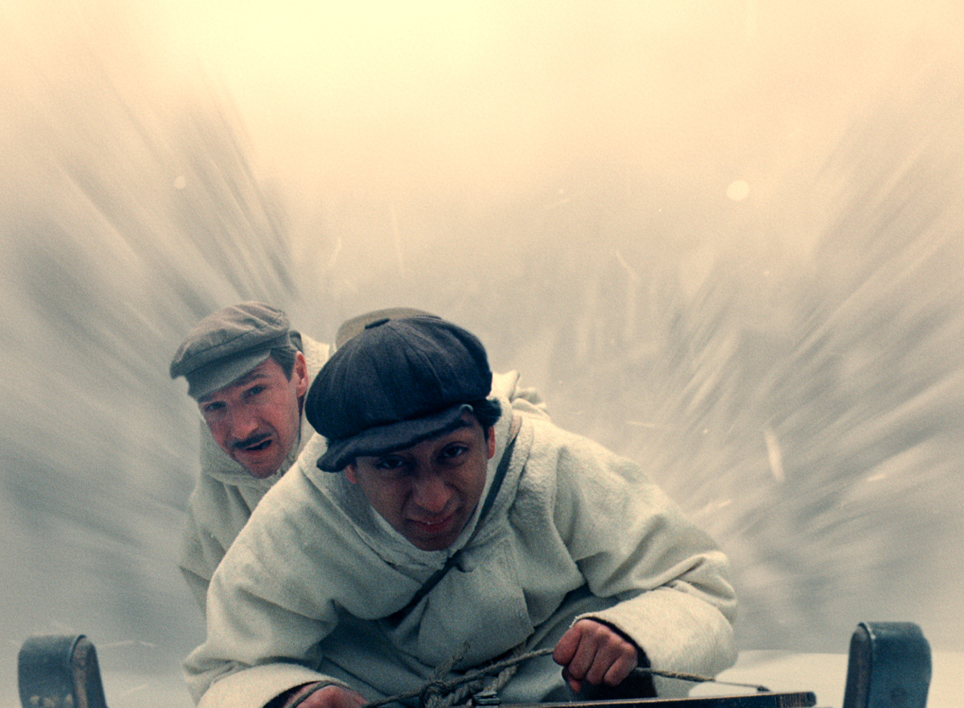M. Gustav (Ralph Fiennes) and Zero (Tony Revolori) in pursuit from a scene in Wes Anderson's The Grand Budapest Hotel.