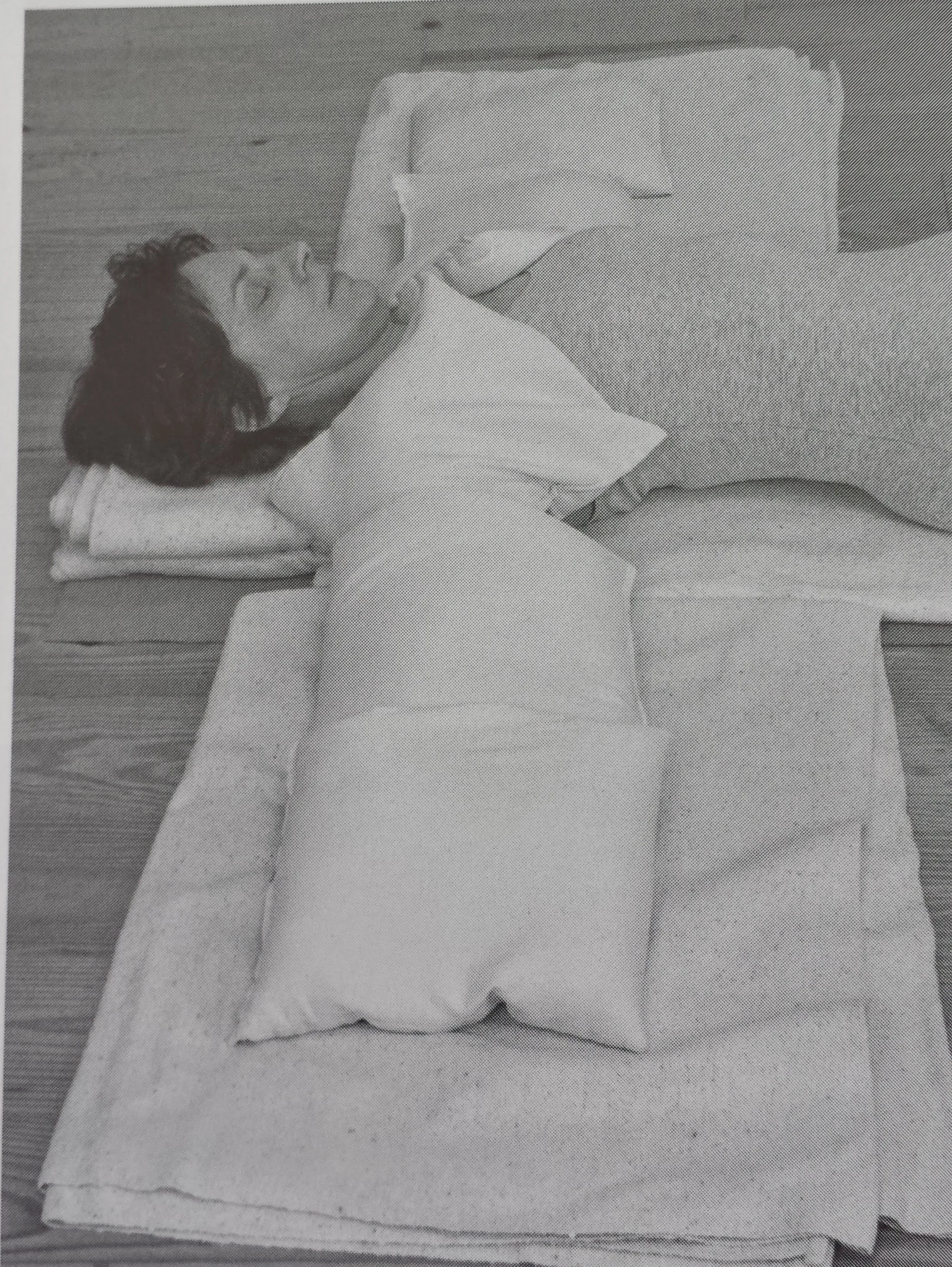 Shoulder Savasana with weights on the shoulders and arms. Sandbags are used here but you can get creative!