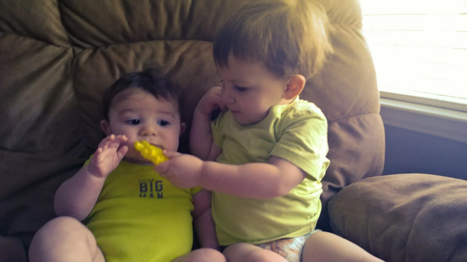 Noah offering "fries" to Luke...plastic of course.