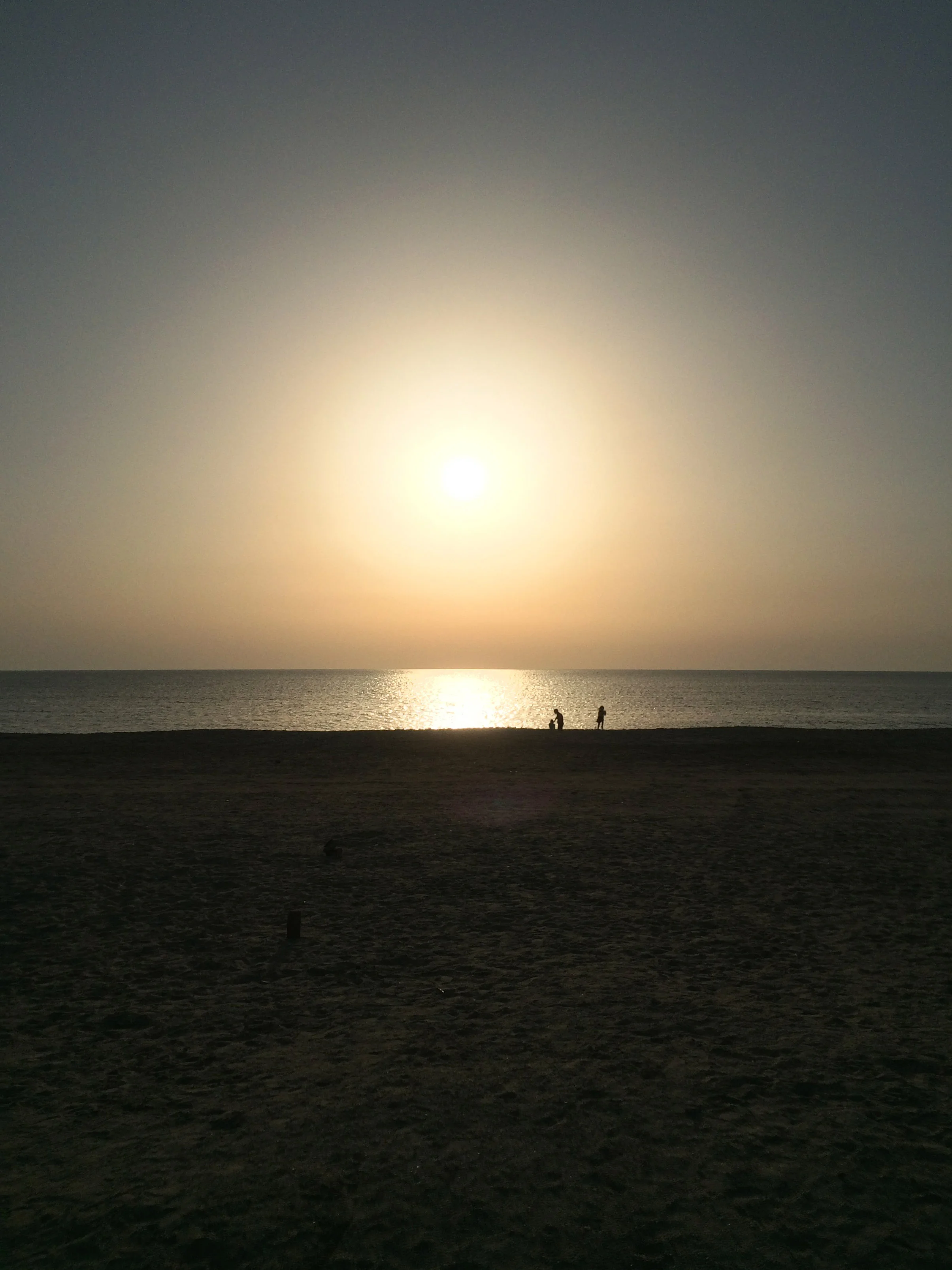 what i will miss: sunset at dukhan beach last month. the girls and i down by the water. taken by ben