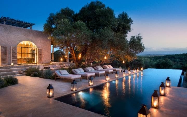 The infinity pool, which overlooks a waterhole used by elephants and giraffes CREDIT: DOOK
