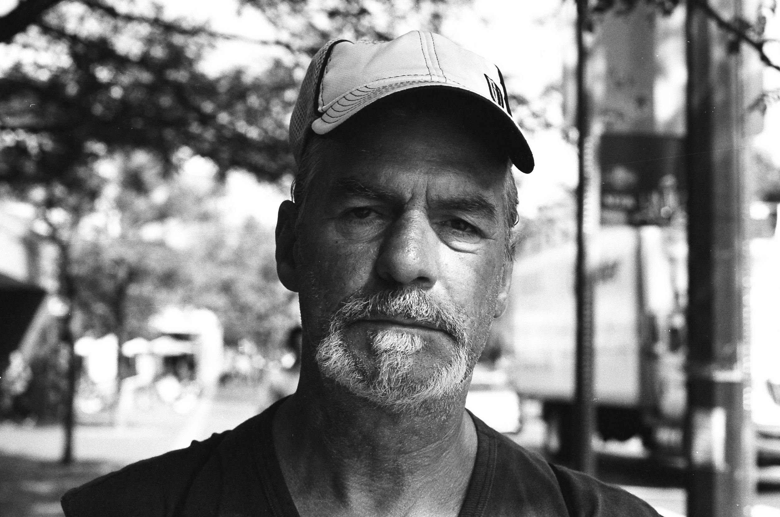 I'm not sure I've take a photo with more emotion in it. "What's the most surprising thing in life?" "Life itself. It's just an every day adventure, for me anyways." "What was the last surprise that happened to you?" "Year and a half ago. I found my son down in the cellar, hung. That was a big surprise. I never thought it'd ever happen. I've been dealing with it since but I've been having a hard time with it. They say "time heals all." I don't believe that. It's how you handle it.