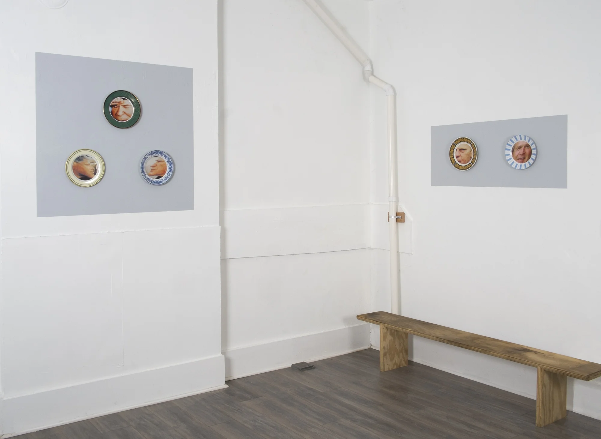 State Dinner Plates-installation view: Left Panel, Clockwise from Top: Bean Gilsdorf. Ronald Reagan, 2018; ceramic plate; 10.25 inch diameter. George H. W. Bush, 2018; ceramic plate; 9.75 inch diameter. Bill Clinton, 2018; ceramic plate; 10 inch diameter. Right Pane l, Left: Gerald Ford, 2018; ceramic plate; 10.5 inch diameter. Right Panel, Right: George W. Bush, 2018; ceramic plate; 10 inch diameter.
