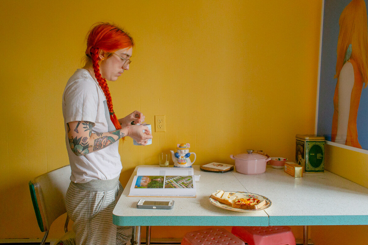 Drinking Tea and Reading Generation Wealth. March 2019. From the series Puberty . © Laurence Philomene