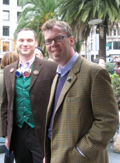 Matt Freedman of San Francisco Steampunks with Emperor's Bridge Campaign founder John Lumea at Union Square, San Francisco, for the procession to the Campaign's 2nd Annual Tannenbaum Toast.