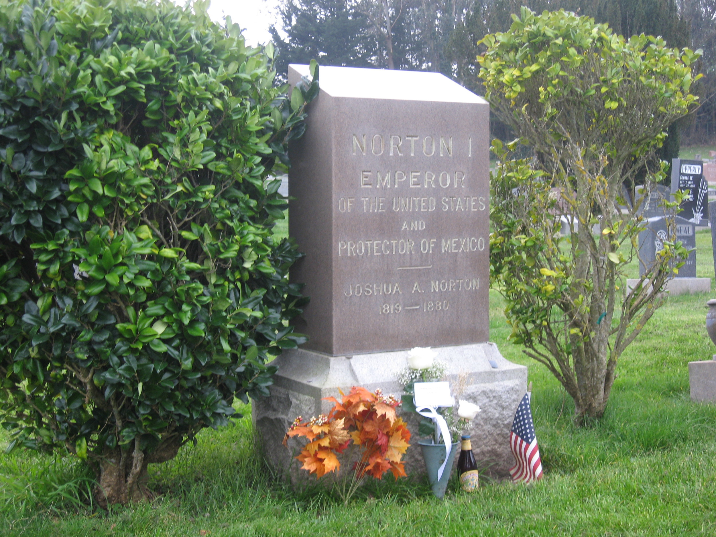 A view of the Emperor's gravestone on Emperor Norton Day, 8 January 2015. The Emperor's Bridge Campaign left the taller of the two roses. The bottle of Anchor Steam to the right still was cold when we got there. When we stopped in to raise a glass (Jameson's) at Molloy's, a half-hour later, we learned that we'd just missed the fellow who bought the bottle there.